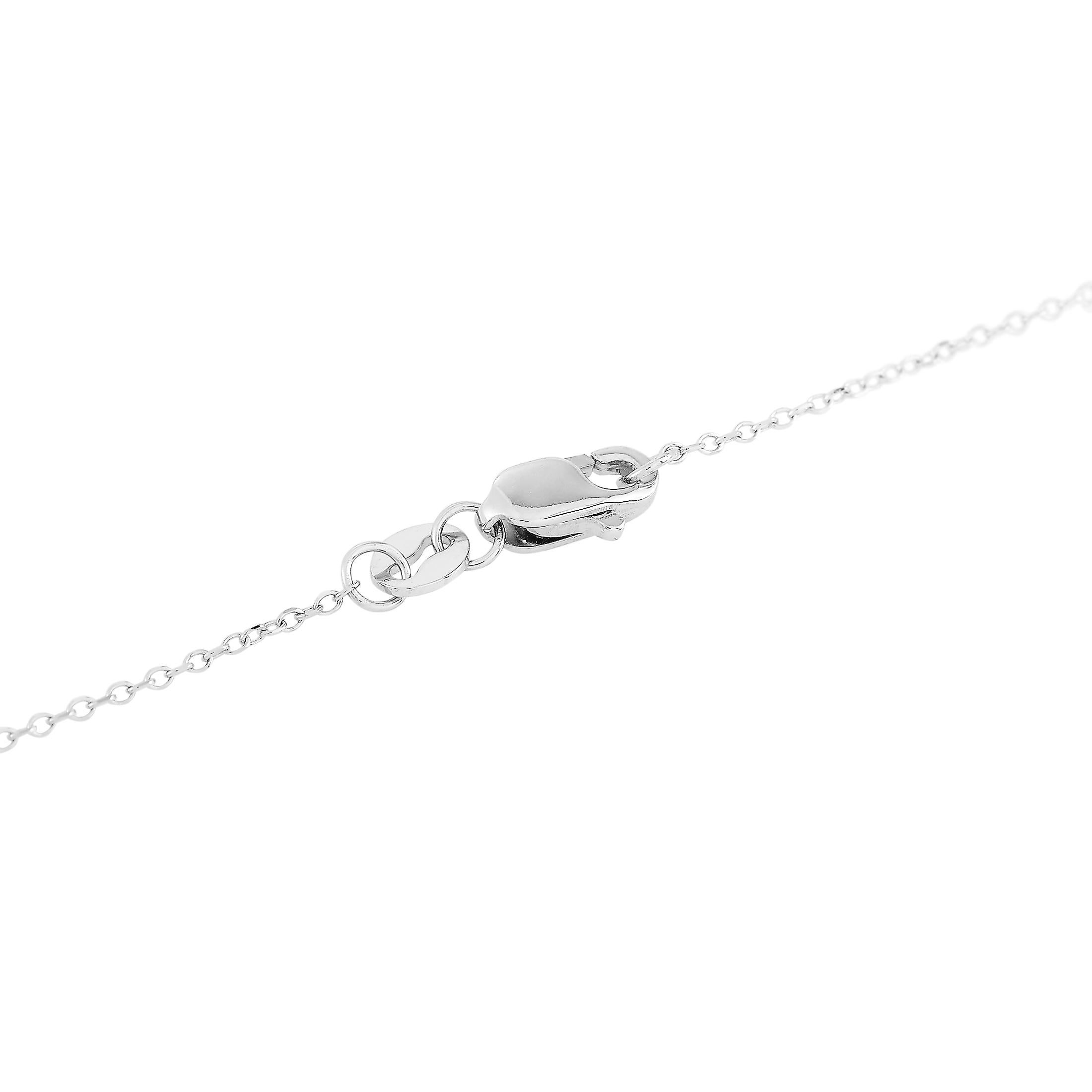 This LB Exclusive necklace is made of 14K white gold and embellished with diamonds that amount to 0.25 carats. The necklace weighs 1.9 grams and boasts a 16” chain and a pendant that measures 0.50” in length and 0.37” in width.
 
 Offered in brand
