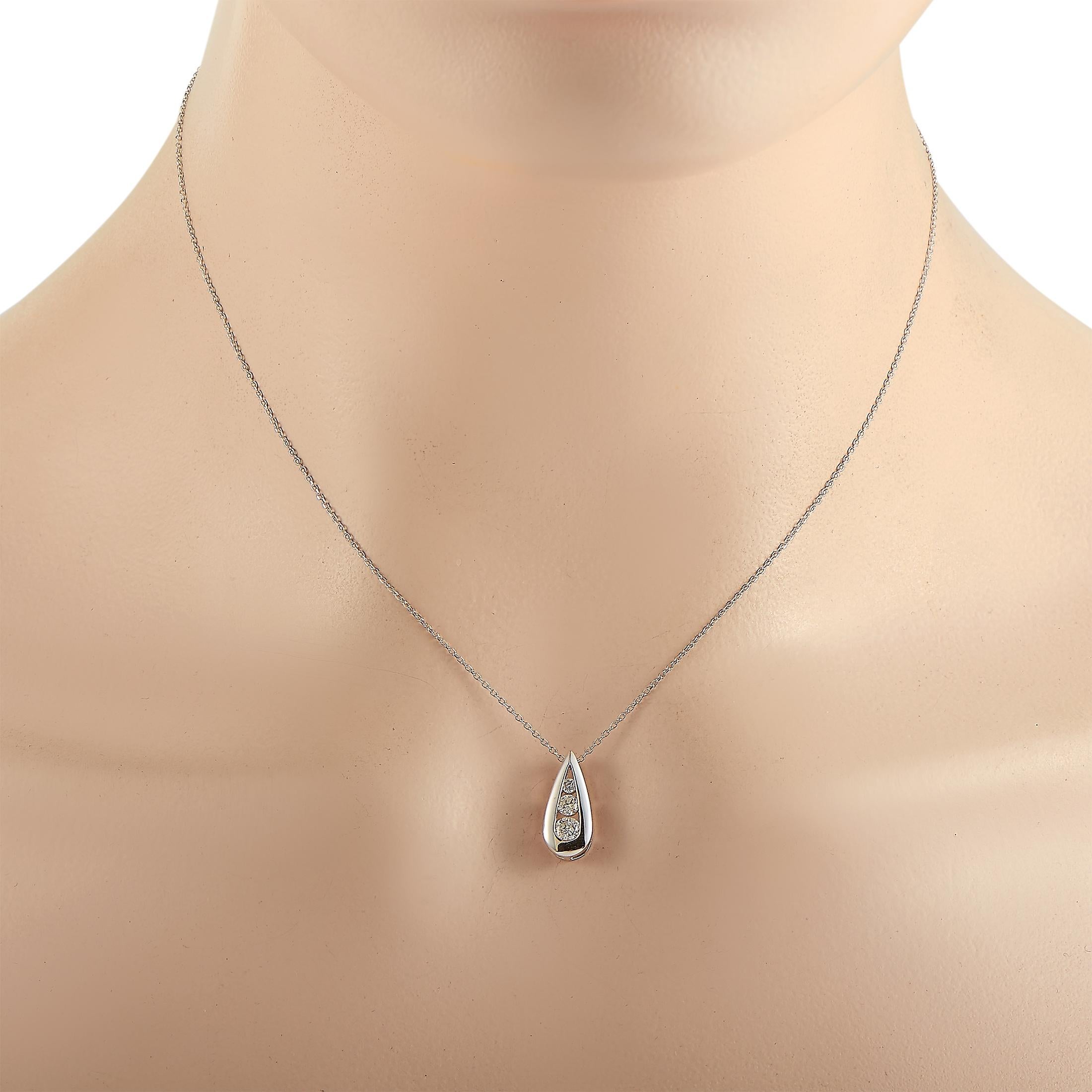 This LB Exclusive necklace is crafted from 14K white gold and weighs 2.6 grams. It is presented with a 16” chain and a pendant that measures 0.55” in length and 0.37” in width. The necklace is embellished with diamonds that total 0.35 carats.
 
