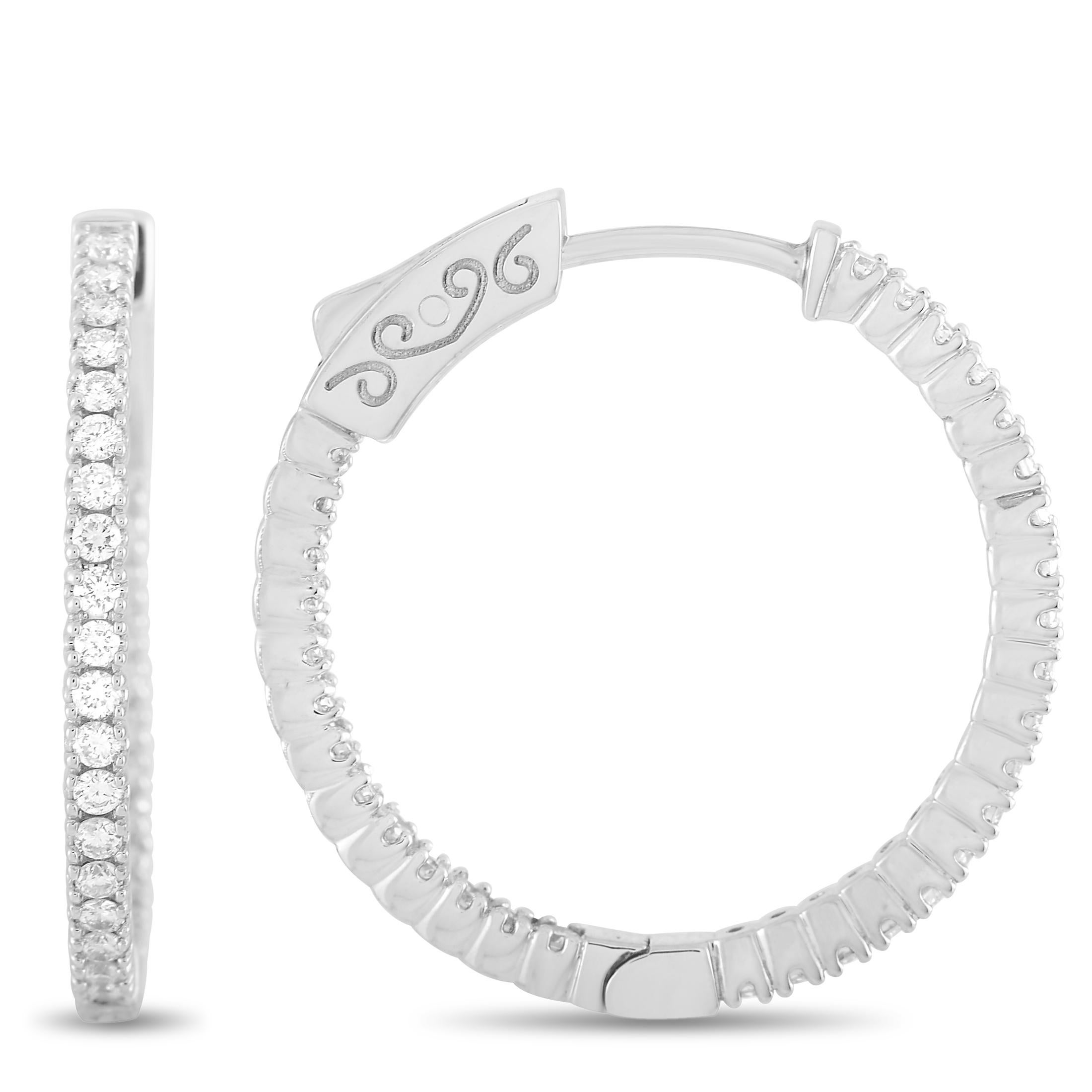 These LB Exclusive hoop earrings are made of 14K white gold and embellished with diamonds that amount to 0.75 carats. The earrings measure 0.80” in length and 0.15” in width, and each of the two weighs 2.3 grams.
 
 The pair is offered in brand new