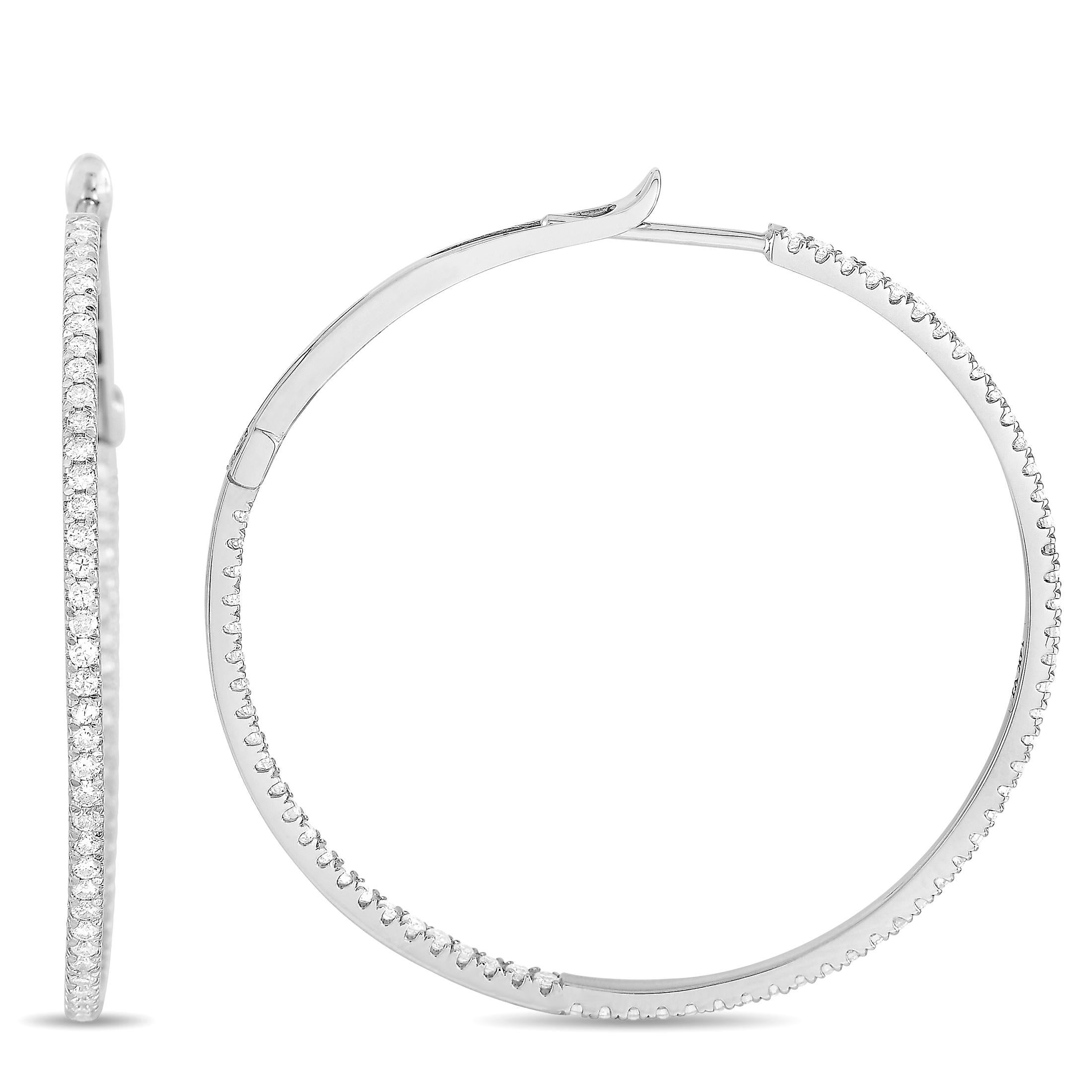 These LB Exclusive hoop earrings are made of 14K white gold and embellished with diamonds that amount to 1.35 carats. The earrings measure 2.75” in height and 2.75” in width and each of the two weighs 3.4 grams.
 
 The pair is offered in brand new