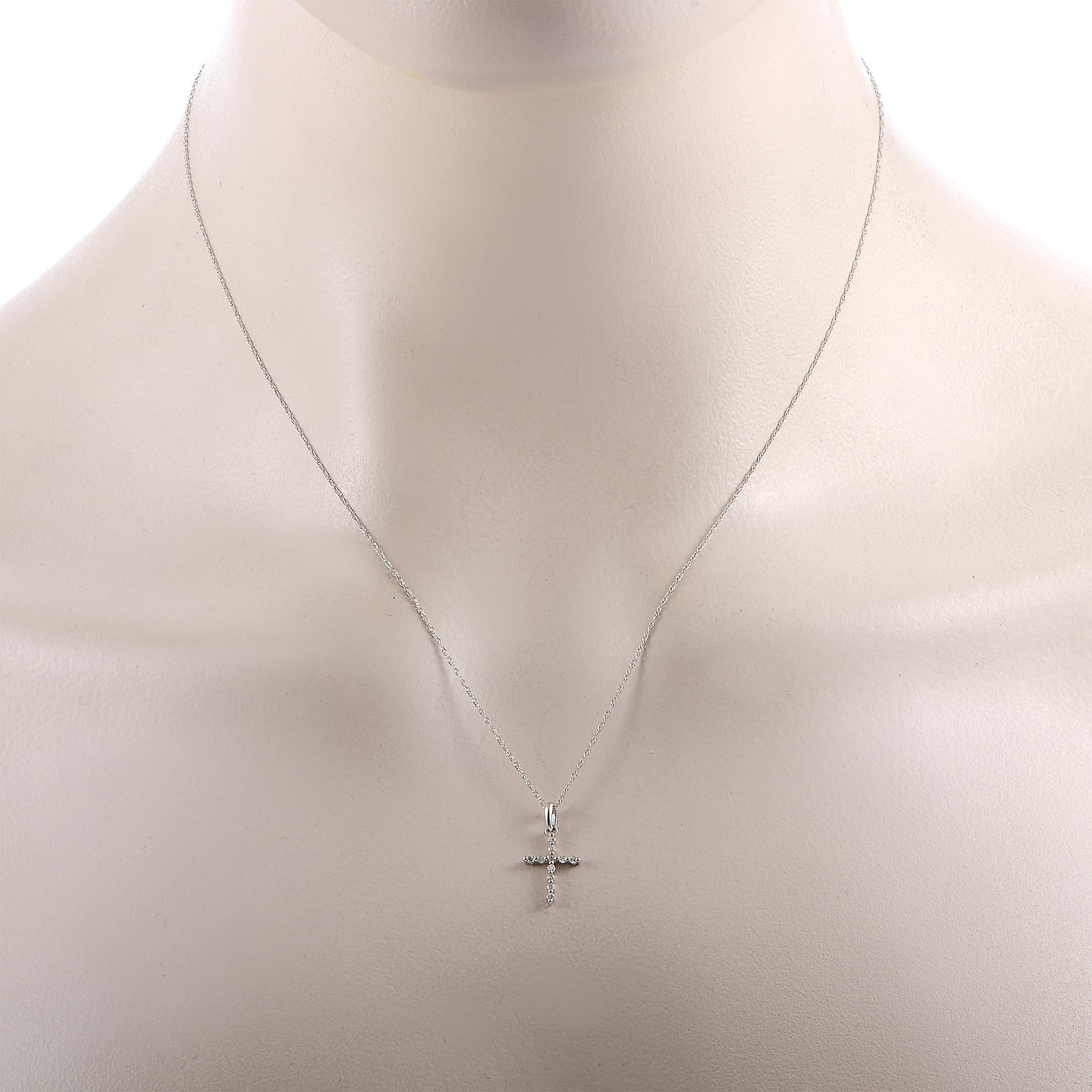 This LB Exclusive necklace is made of 14K white gold and set with a total of 0.09 carats of diamonds. Weighing 0.9 grams, the necklace is presented with an 18” chain featuring spring ring closure and a cross pendant that measures 0.65” in length and