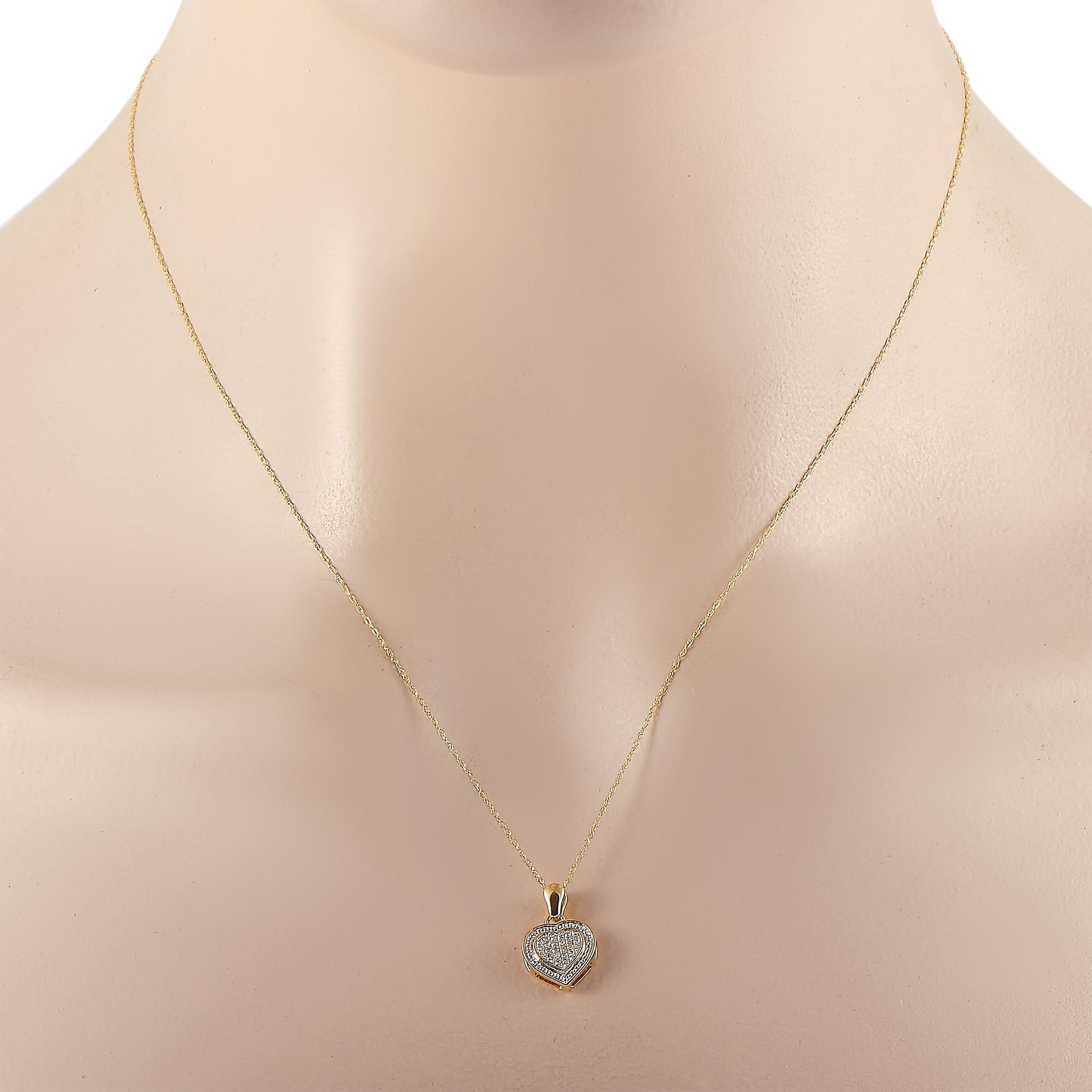 This LB Exclusive necklace is crafted from 14K yellow gold and weighs 1.9 grams. It is presented with an 18” chain and boasts a pendant that measures 0.65” in length and 0.50” in width. The necklace is set with diamonds that total 0.09 carats.
 

