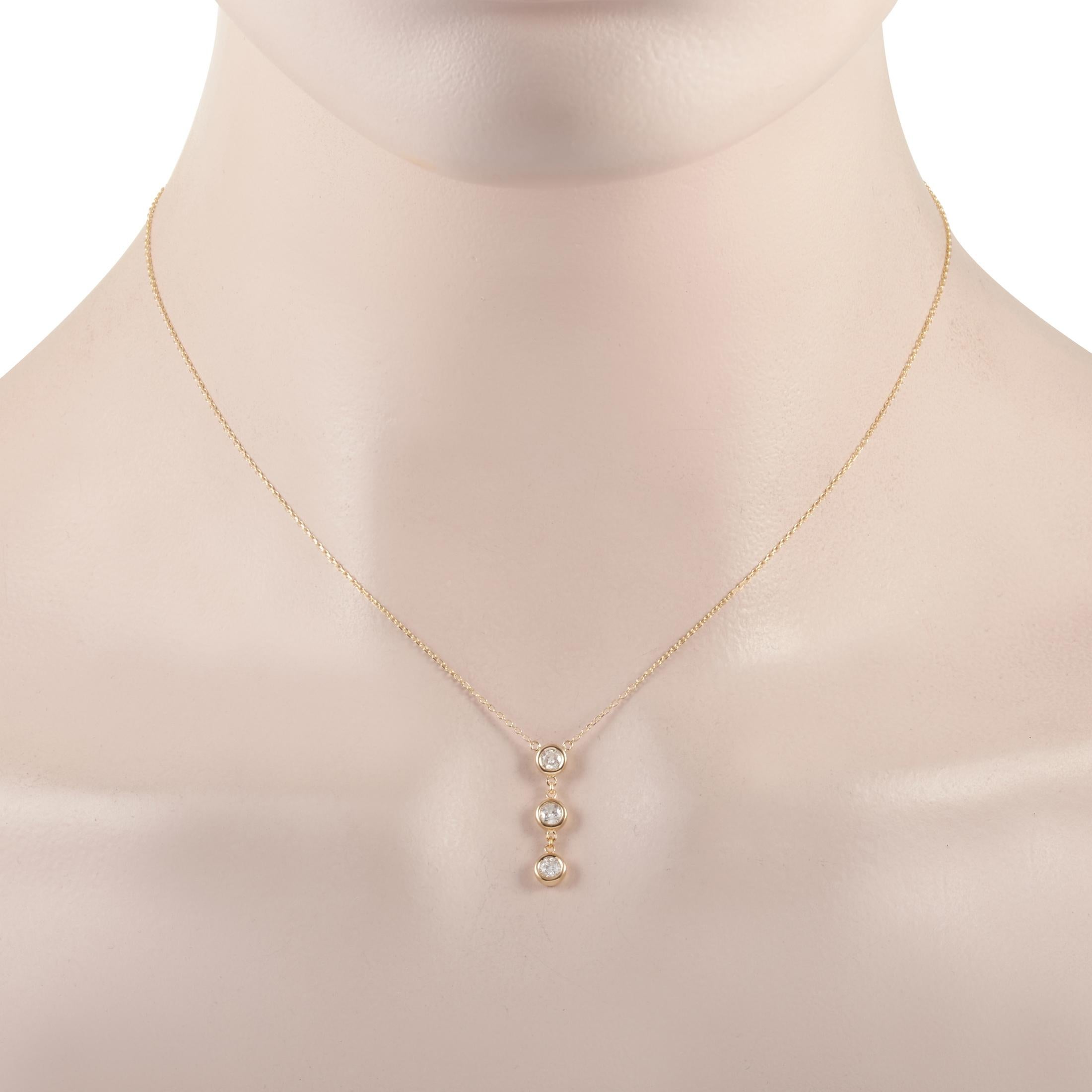 This LB Exclusive necklace is made of 14K yellow gold and embellished with diamonds that amount to 0.35 carats. The necklace weighs 1.9 grams and boasts a 15” chain and a pendant that measures 0.75” in length and 0.13” in width.
 
 Offered in brand