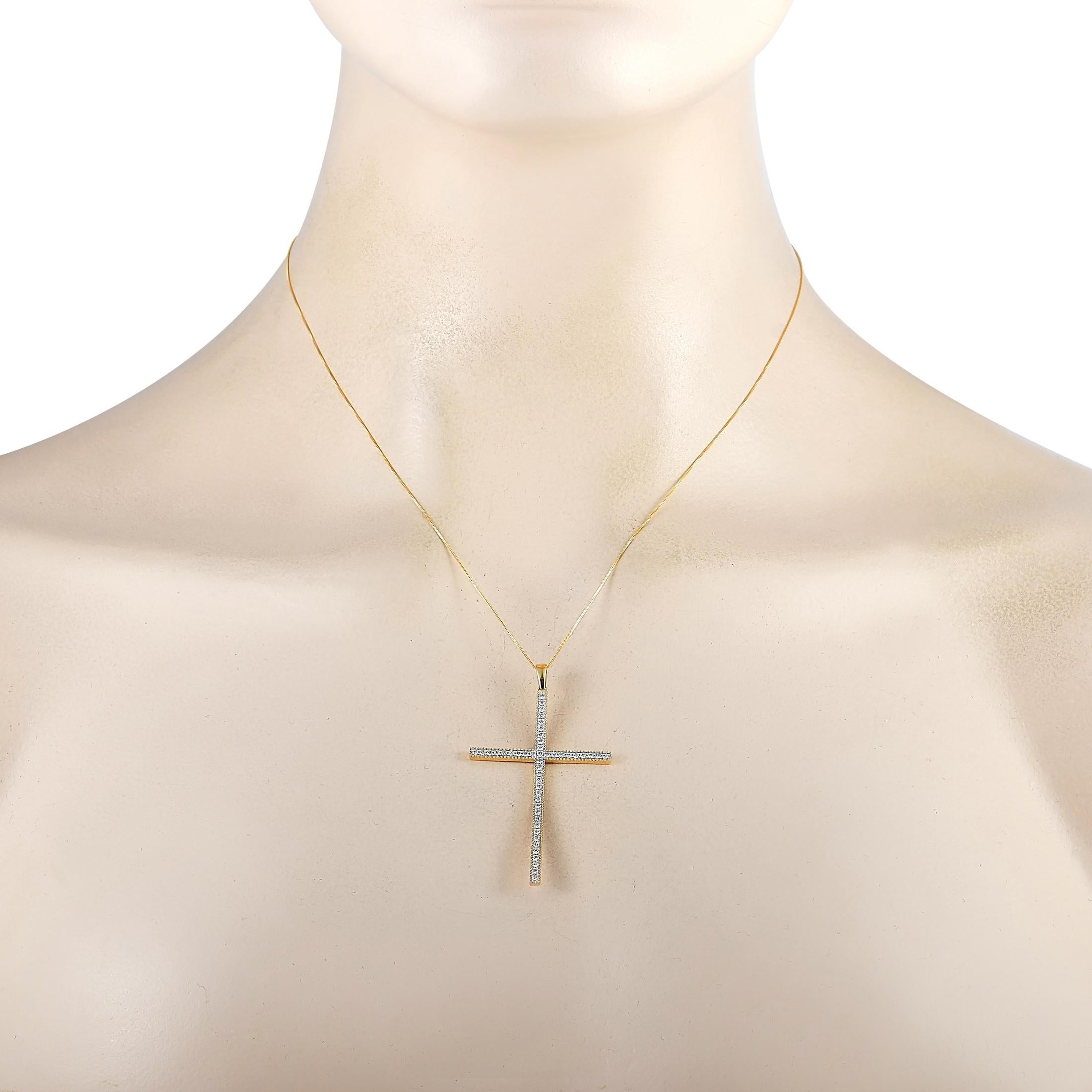 This LB Exclusive necklace is crafted from 14K yellow gold and weighs 3.8 grams. It is presented with a 17” chain and boasts a cross pendant that measures 2” in length and 1.25” in width. The necklace is set with diamonds that total 0.50 carats.
 
