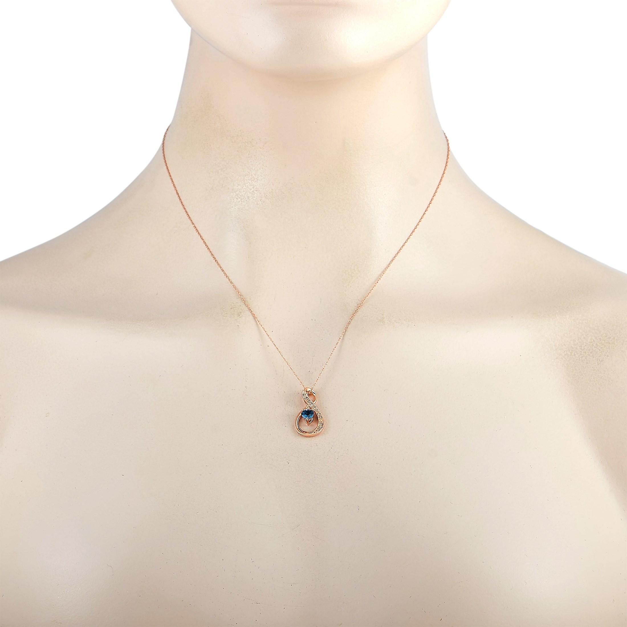 This LB Exclusive necklace is made of 14K rose gold and embellished with blue topaz and a total of 0.03 carats of diamonds. The necklace weighs 2.6 grams and is presented with a 17.50” chain and a pendant that measures 0.87” in length and 0.45” in