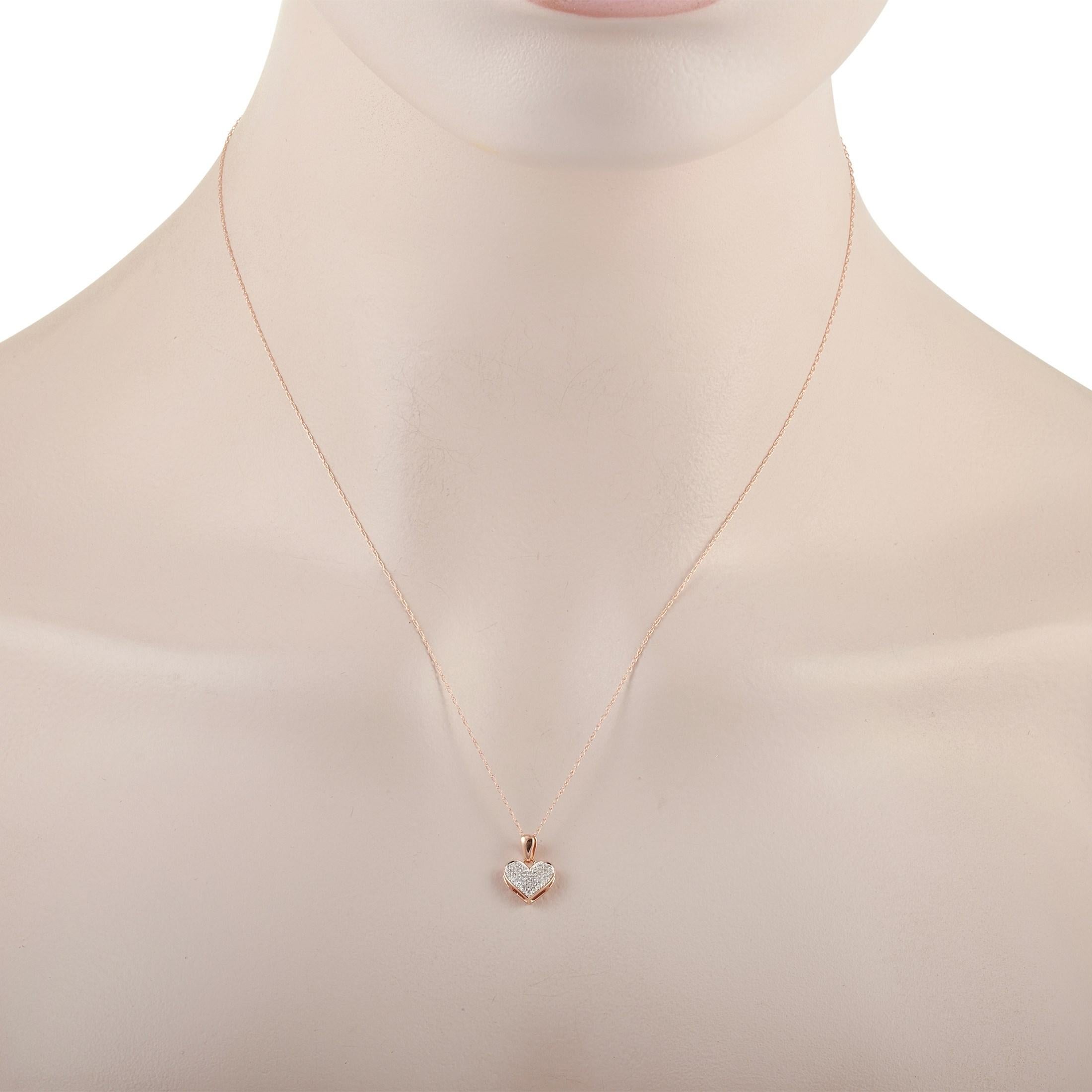 The LB Exclusive 14K Rose Gold 0.08 ct Diamond Heart Pendant Necklace features a delicate 14K Rose Gold chain that is 18 inches in length and includes a matching rose gold heart pendant set with 0.08 carats of round cut diamonds. The pendant