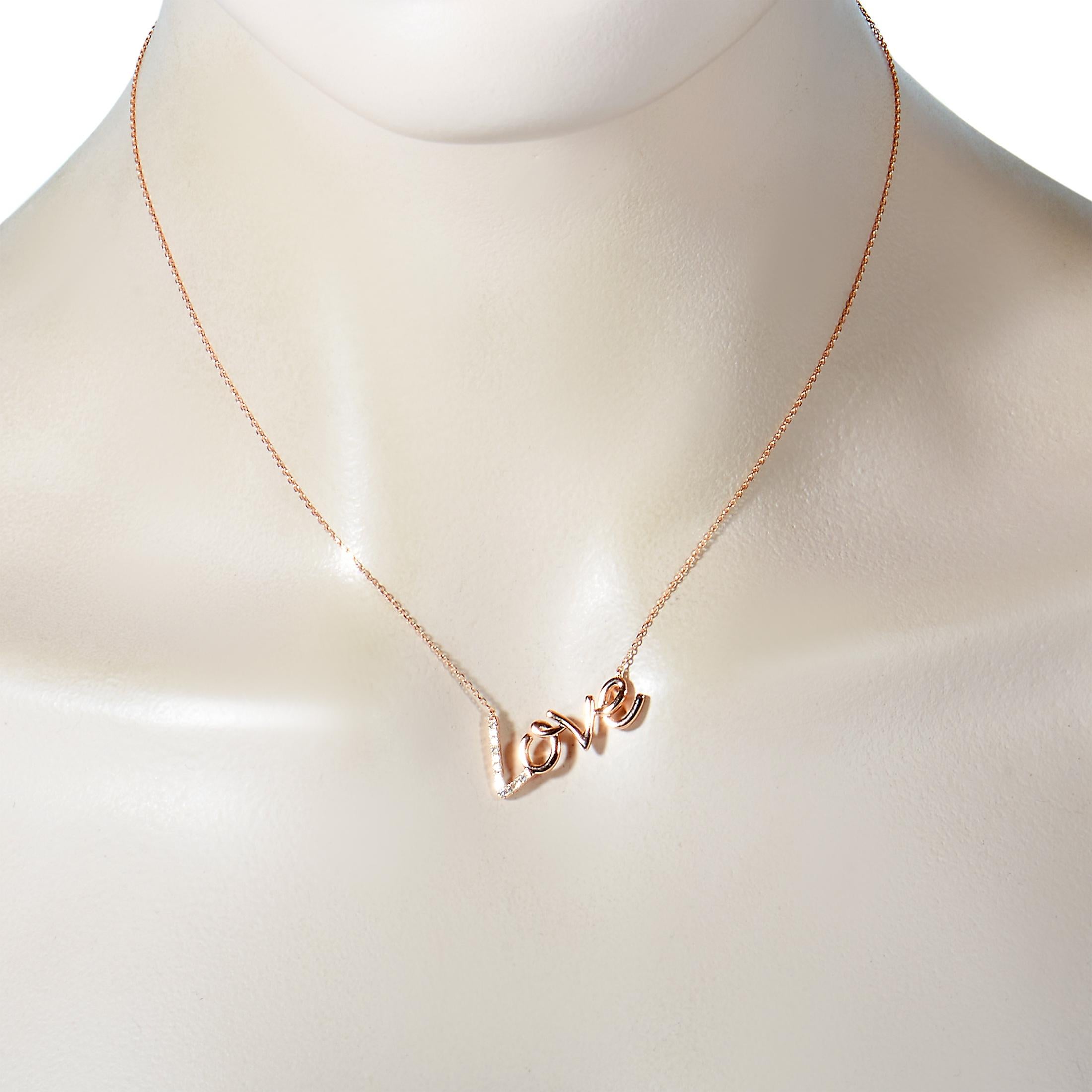 This LB Exclusive necklace is made of 14K rose gold and embellished with diamonds that amount to 0.10 carats. The necklace weighs 3.1 grams and boasts a 14” chain and a “love” pendant that measures 1” in length and 0.50” in width.
 
 Offered in