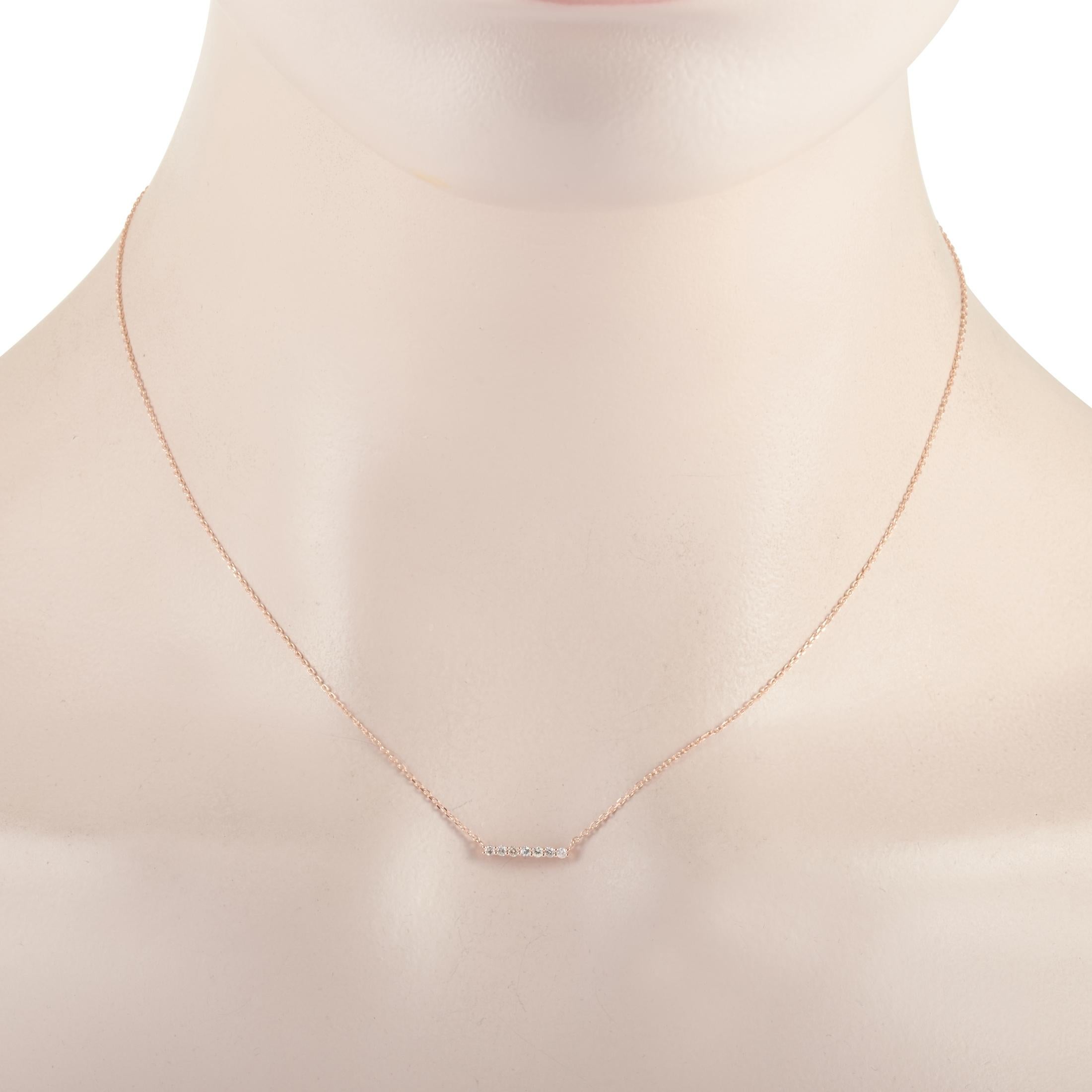 This LB Exclusive necklace is crafted from 14K rose gold and weighs 1.3 grams. It is presented with a 15” chain and boasts a pendant that measures 0.07” in length and 0.44” in width. The necklace is set with diamonds that total 0.10 carats.
 
