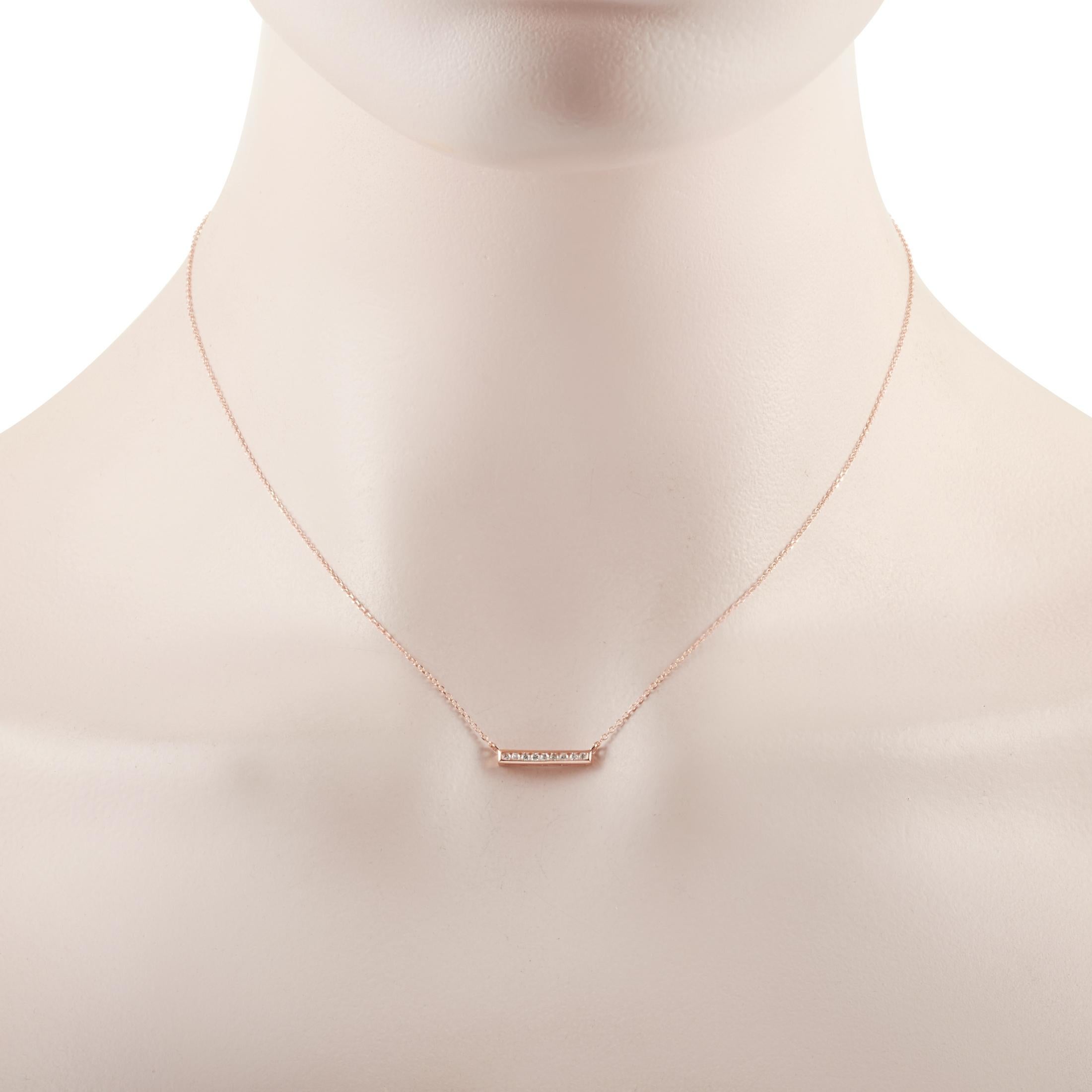 This LB Exclusive necklace is crafted from 14K rose gold and weighs 1.6 grams. It is presented with a 15” chain and boasts a pendant that measures 0.13” in length and 0.50” in width. The necklace is set with diamonds that total 0.10 carats.
 
