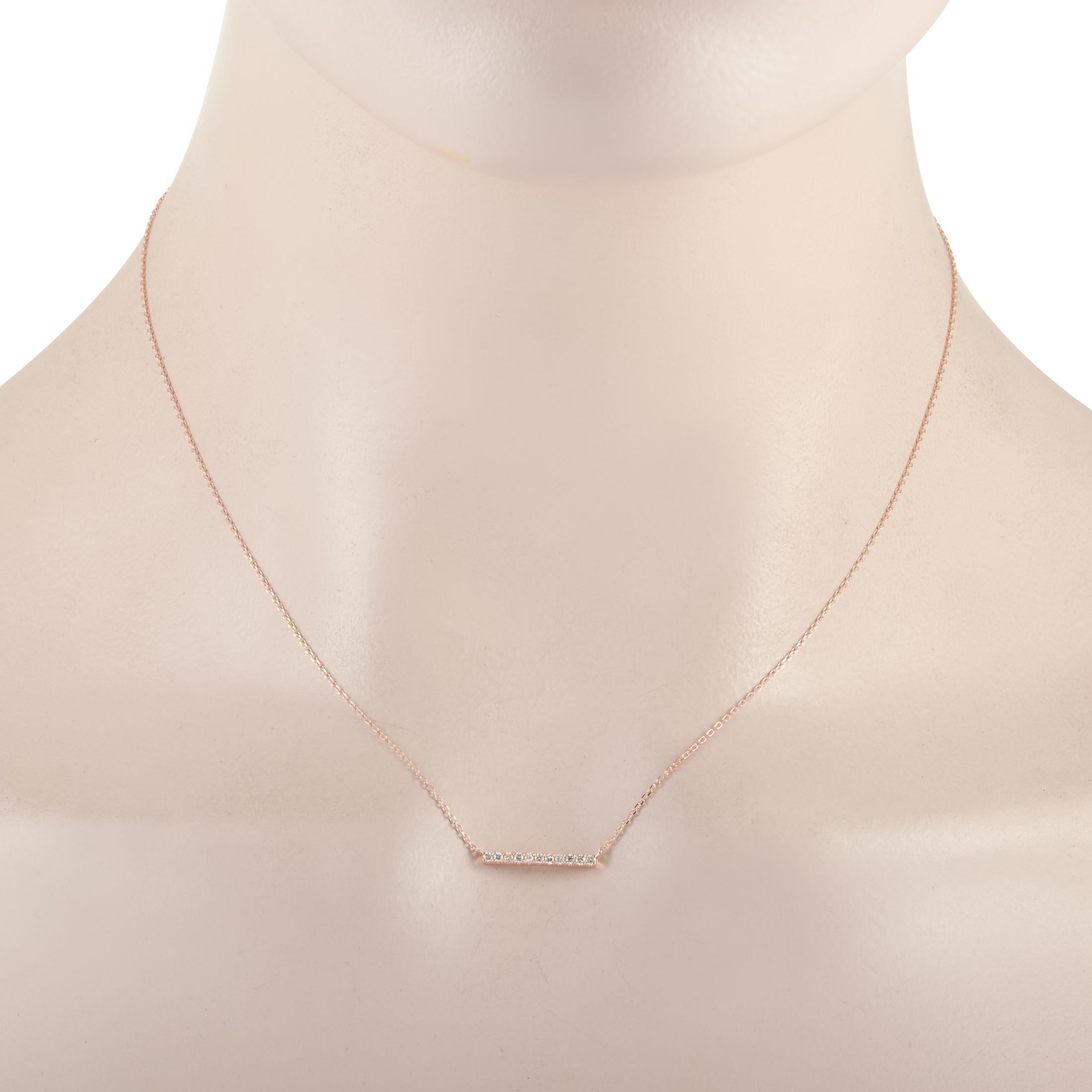 This LB Exclusive necklace is crafted from 14K rose gold and weighs 1.6 grams. It is presented with a 15” chain and boasts a pendant that measures 0.07” in length and 0.63” in width. The necklace is set with diamonds that total 0.10 carats.
 
