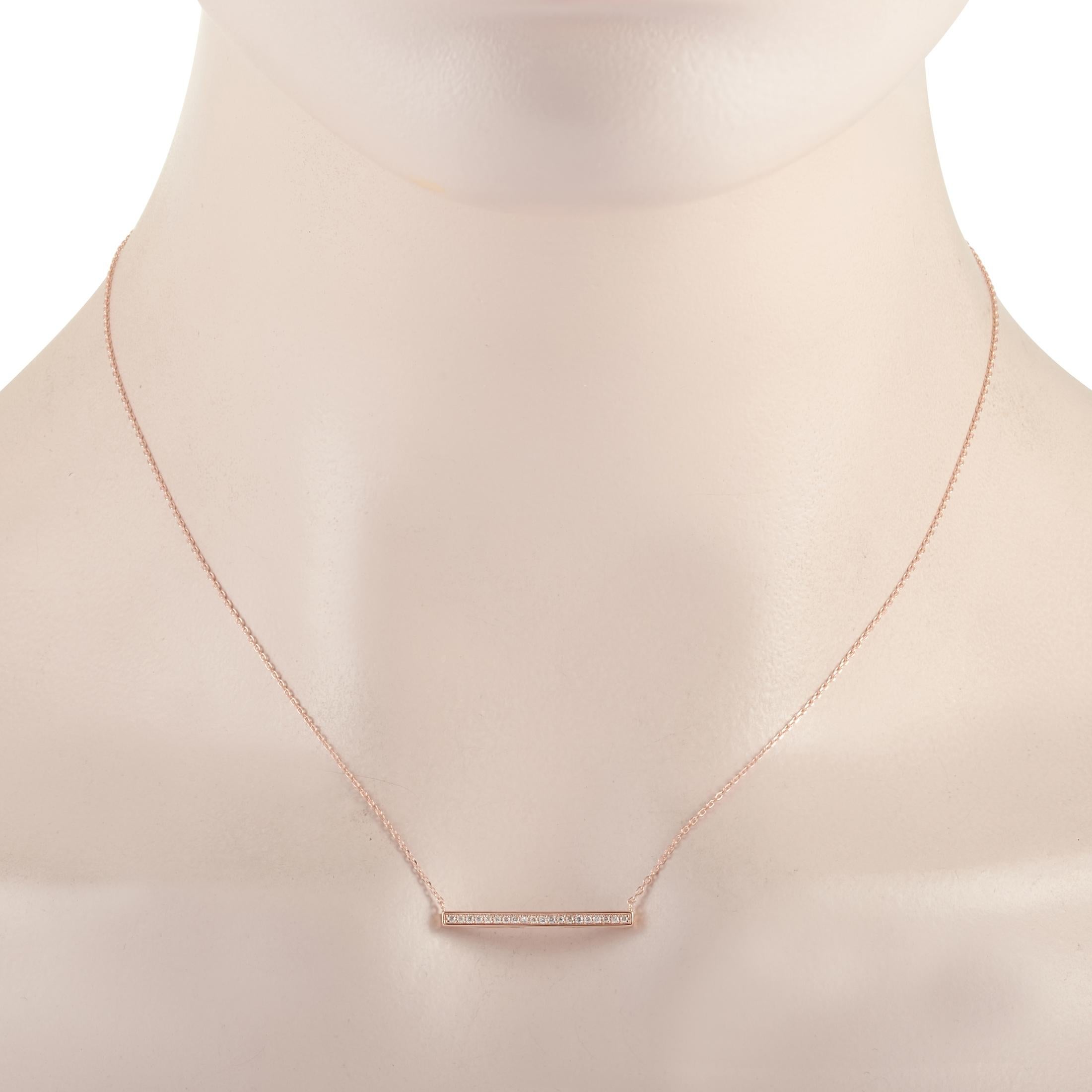 This LB Exclusive necklace is crafted from 14K rose gold and weighs 1.8 grams. It is presented with a 15” chain and boasts a pendant that measures 0.07” in length and 1” in width. The necklace is set with diamonds that total 0.10 carats.
 
