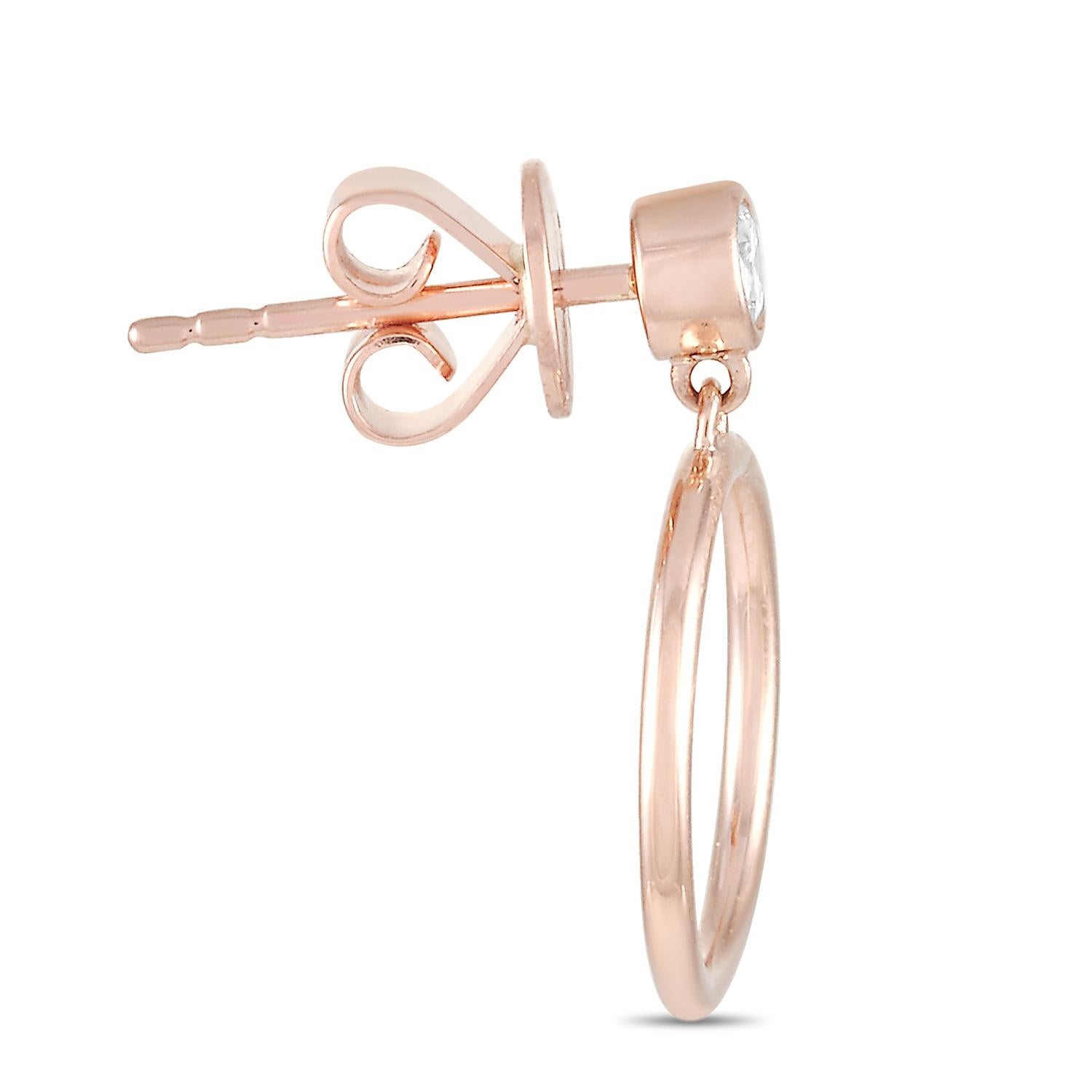 These LB Exclusive earrings are made of 14K rose gold and embellished with diamonds that amount to 0.18 carats. The earrings measure 0.63” in length and 0.50” in width and each of the two weighs 1.1 grams.
 
 The pair is offered in brand new