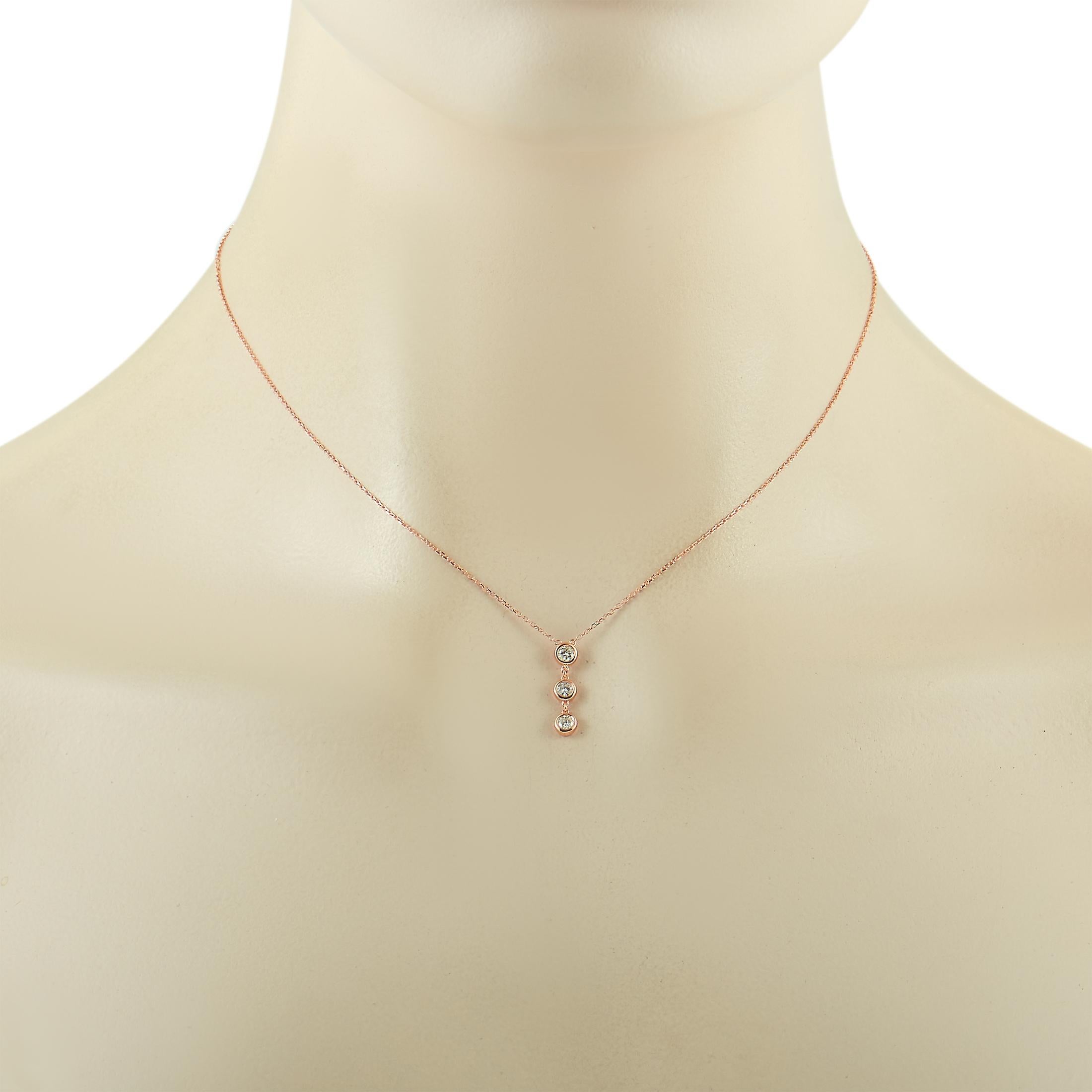 This LB Exclusive necklace is made of 14K rose gold and embellished with diamonds that amount to 0.25 carats. The necklace weighs 1.6 grams and boasts a 16” chain and a pendant that measures 0.60” in length and 0.12” in width.
 
 Offered in brand