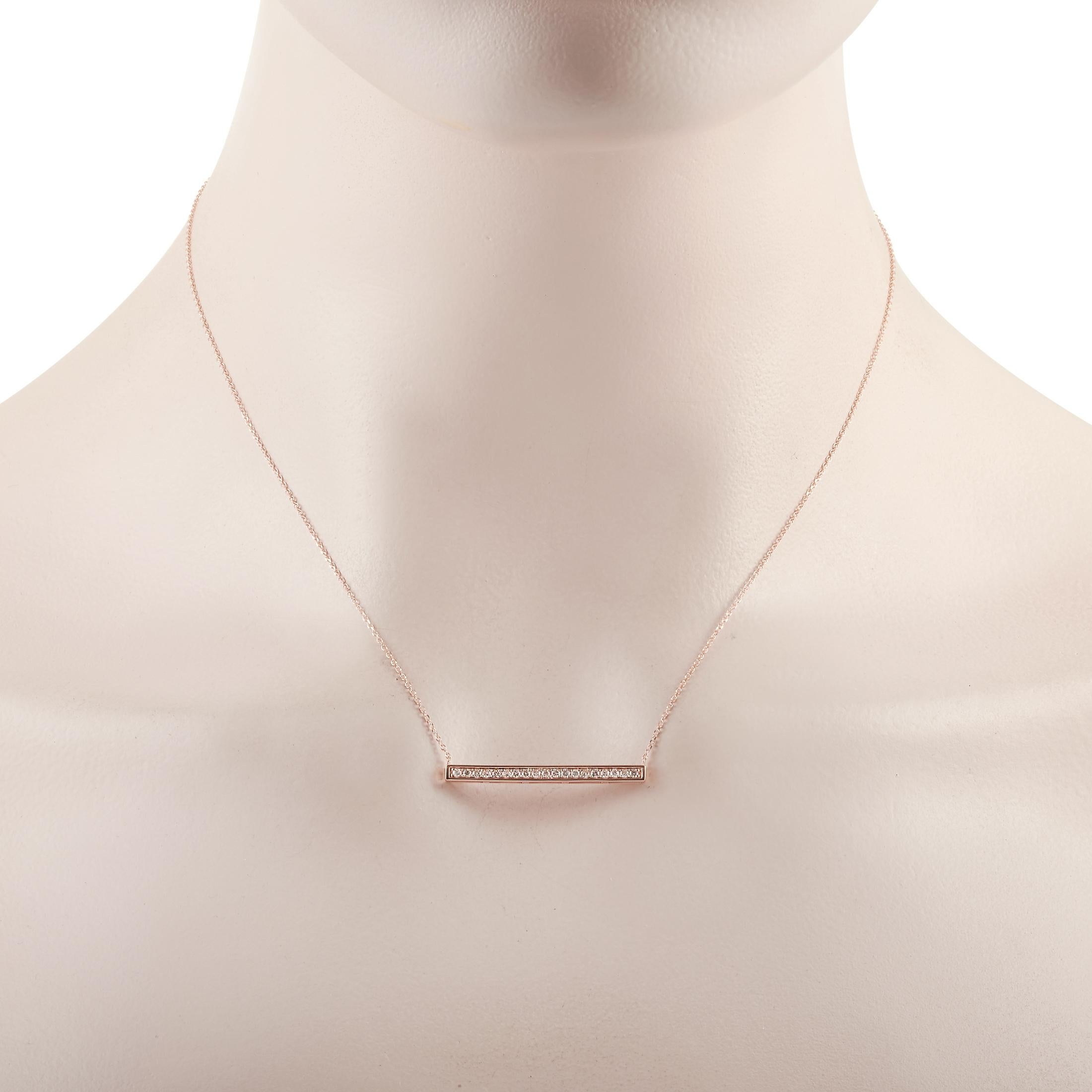 This LB Exclusive necklace is crafted from 14K rose gold and weighs 2.1 grams. It is presented with a 15” chain and boasts a pendant that measures 0.13” in length and 1.25” in width. The necklace is set with diamonds that total 0.25 carats.
 
