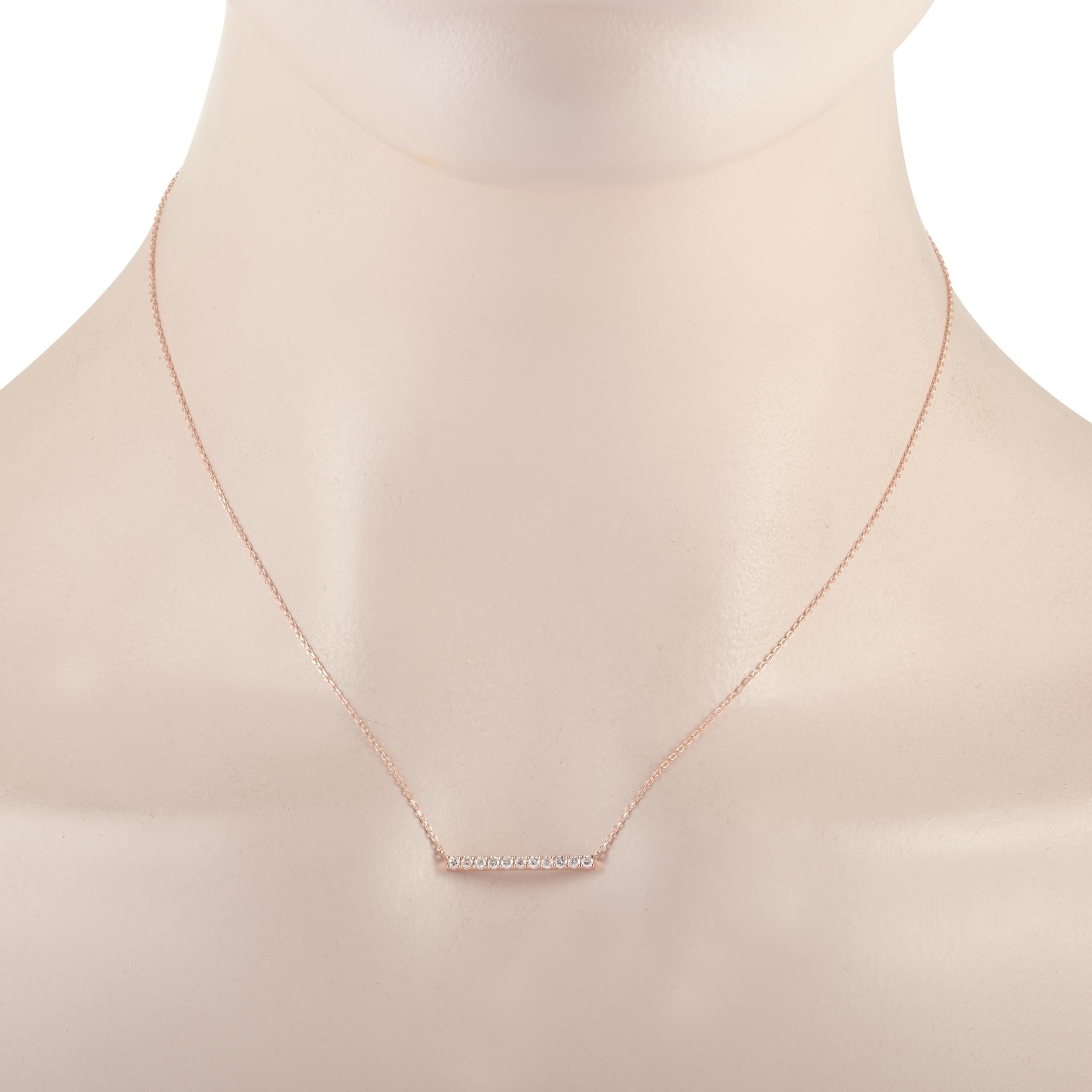 This LB Exclusive necklace is crafted from 14K rose gold and weighs 2 grams. It is presented with a 15” chain and boasts a pendant that measures 0.07” in length and 0.75” in width. The necklace is set with diamonds that total 0.25 carats.
 
 Offered