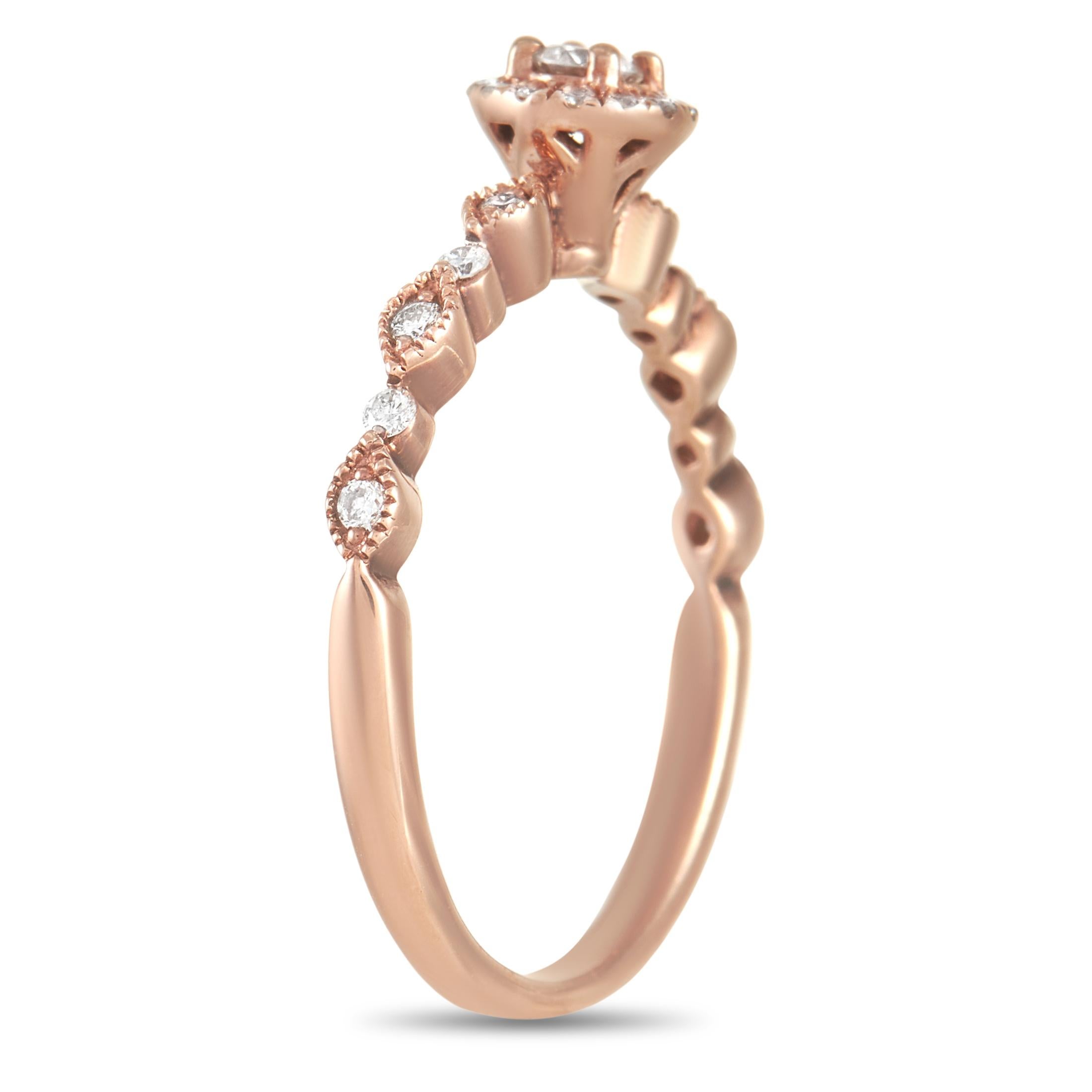 This gorgeous LB Exclusive 14K Rose Gold 0.25 ct Diamond Ring is made with 14K rose gold and set with a row of round-cut diamonds on either side of a round cut diamond center stone which is accented with a halo of smaller round-cut diamonds for a