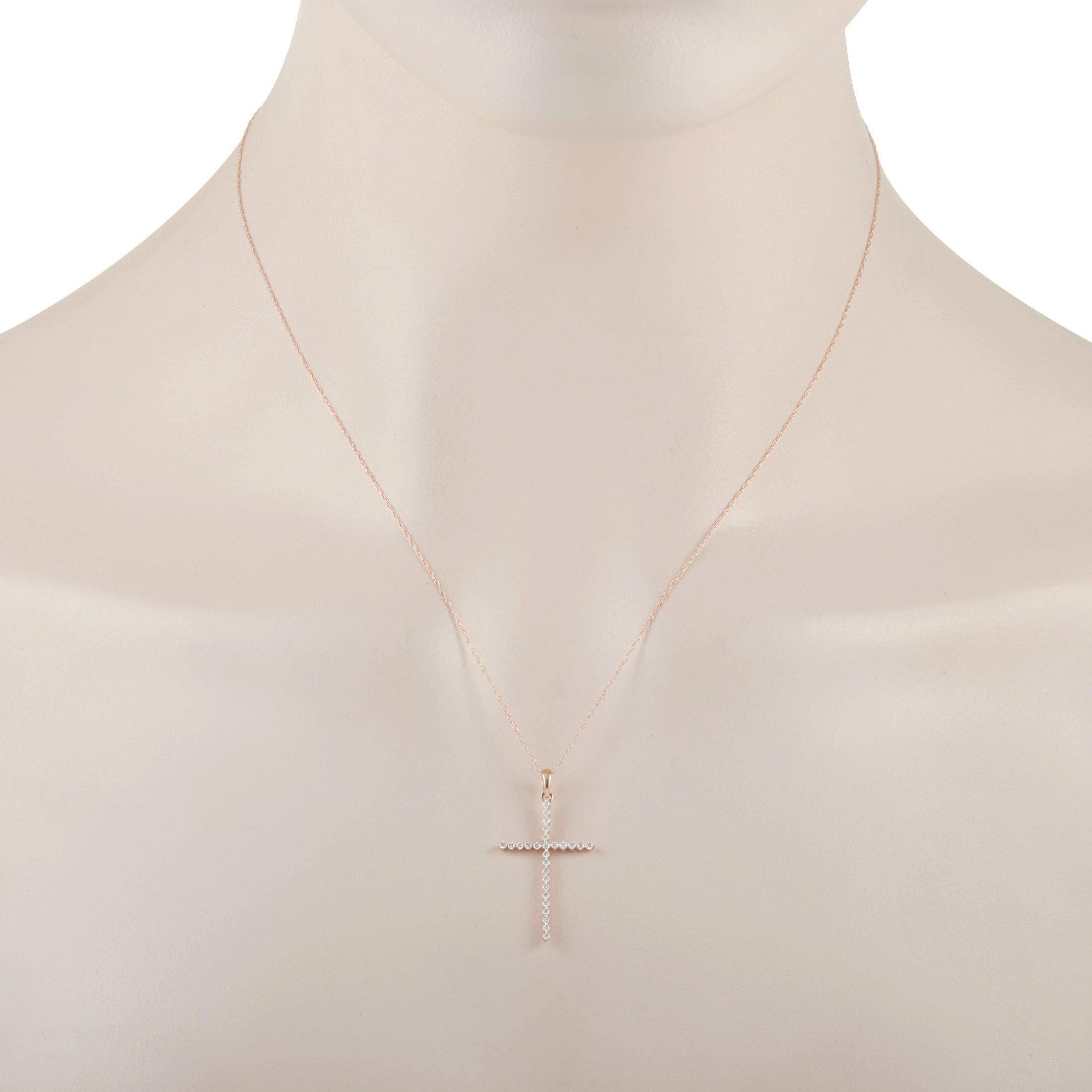 This pendant necklace possesses an inherent opulence. The beauty of this piece begins with the delicate 17” long 14K Rose Gold chain, which secures via spring ring closure. Suspended from the chain, you’ll find an elegant cross shaped pendant