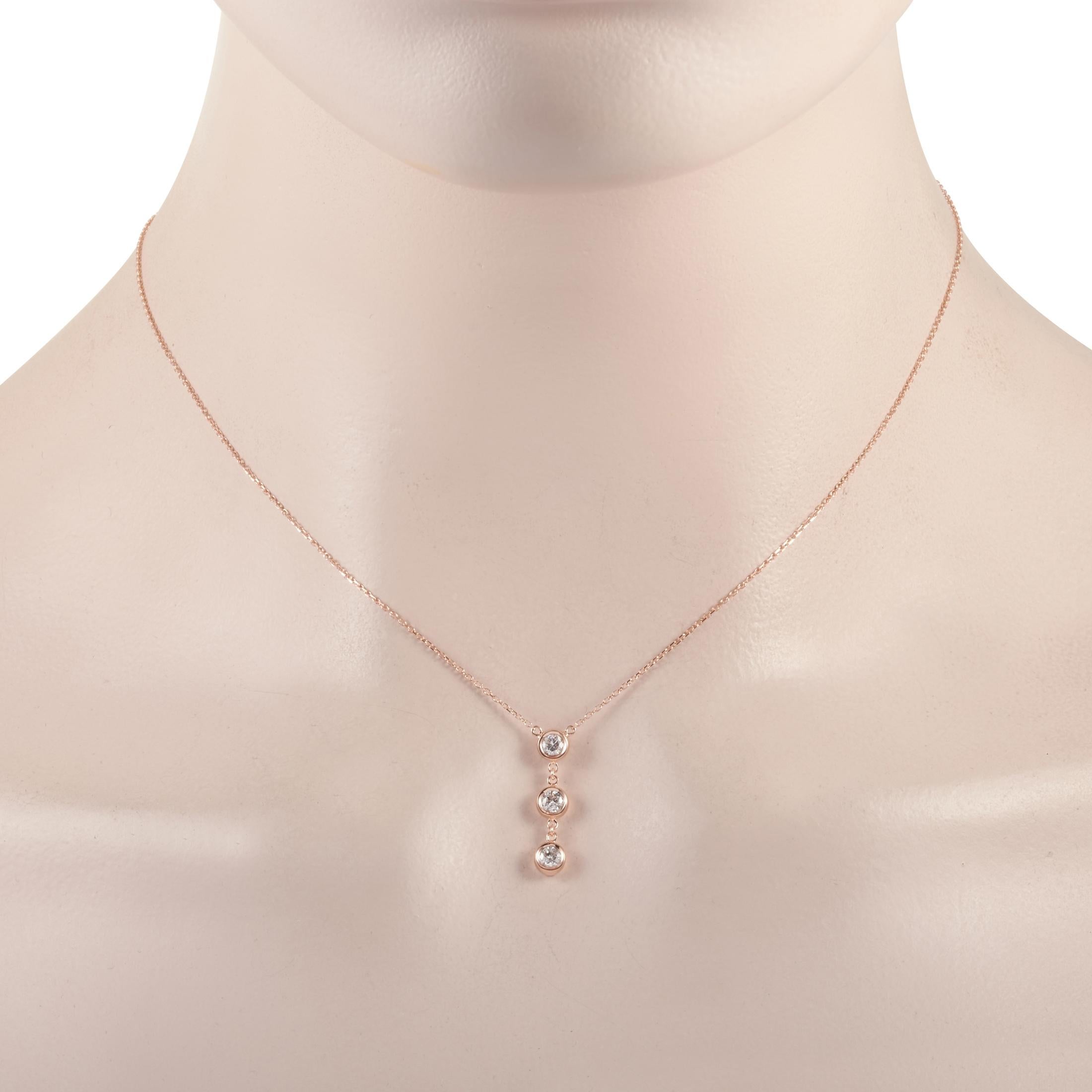 This LB Exclusive necklace is made of 14K rose gold and embellished with diamonds that amount to 0.35 carats. The necklace weighs 1.9 grams and boasts a 15” chain and a pendant that measures 0.75” in length and 0.13” in width.
 
 Offered in brand