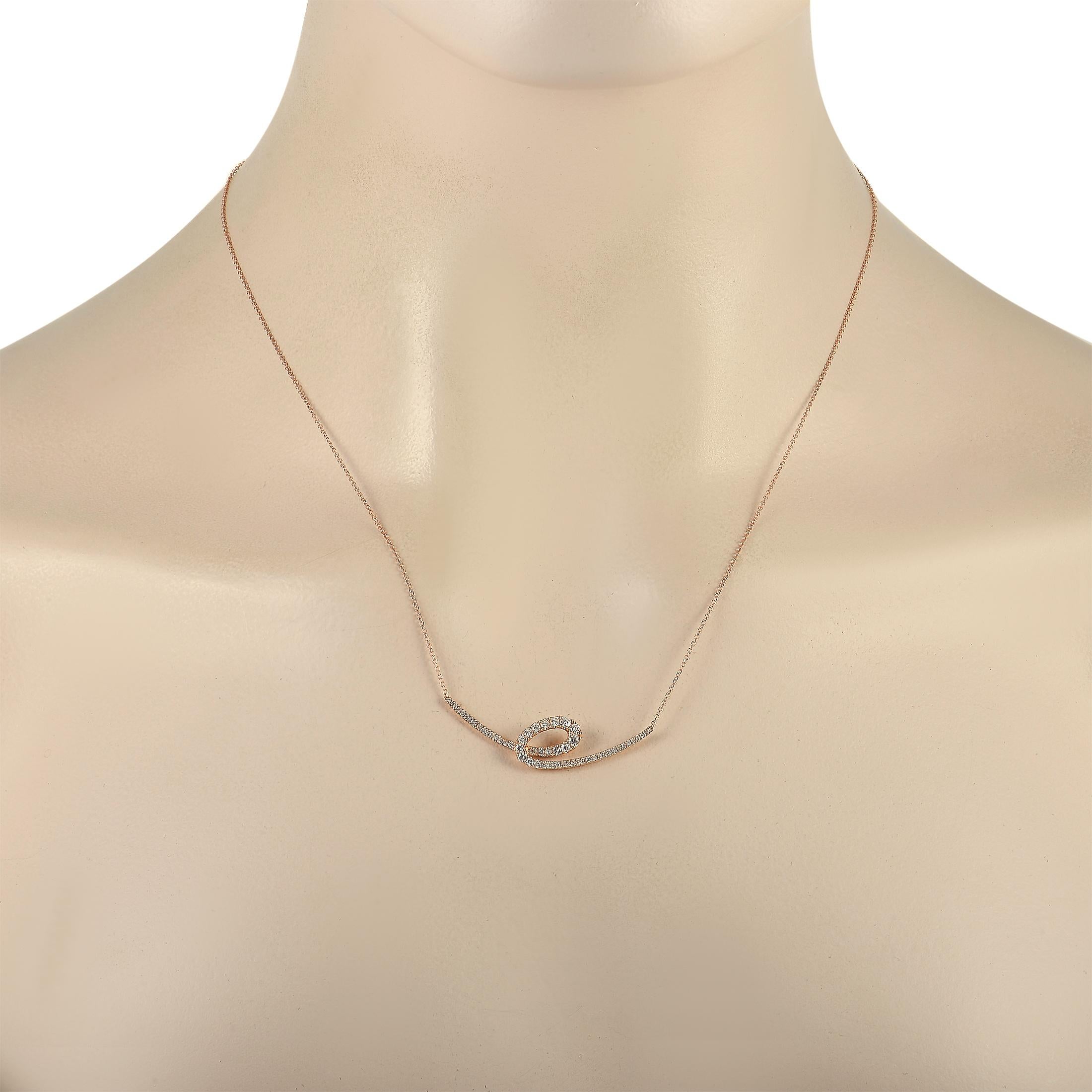 This sleek, simple pendant necklace is a piece that will elevate any ensemble. Crafted from 14K rose gold, a pendant measuring 1.5” long and 0.5” wide is elegantly suspended from an 16” chain. The gracefully curved design of the pendant is made even