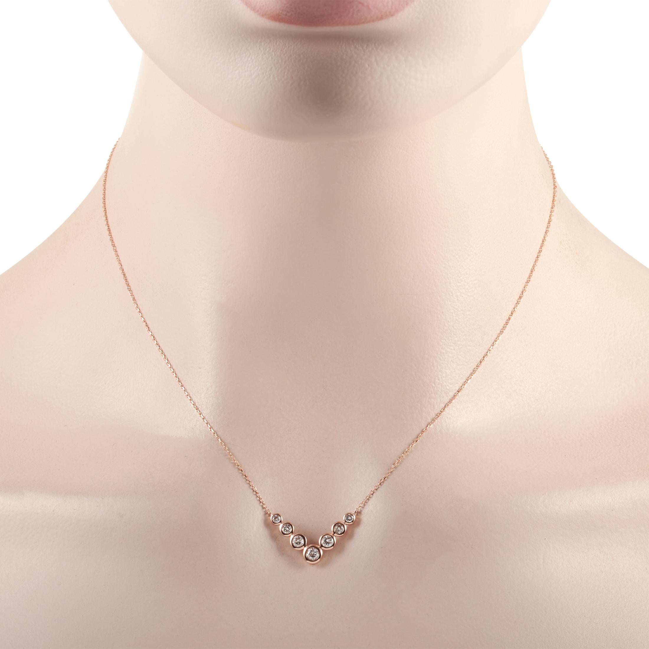 This LB Exclusive necklace is made of 14K rose gold and embellished with diamonds that amount to 0.50 carats. The necklace weighs 2.4 grams and boasts a 15” chain and a pendant that measures 0.50” in length and 0.75” in width.
 
 Offered in brand