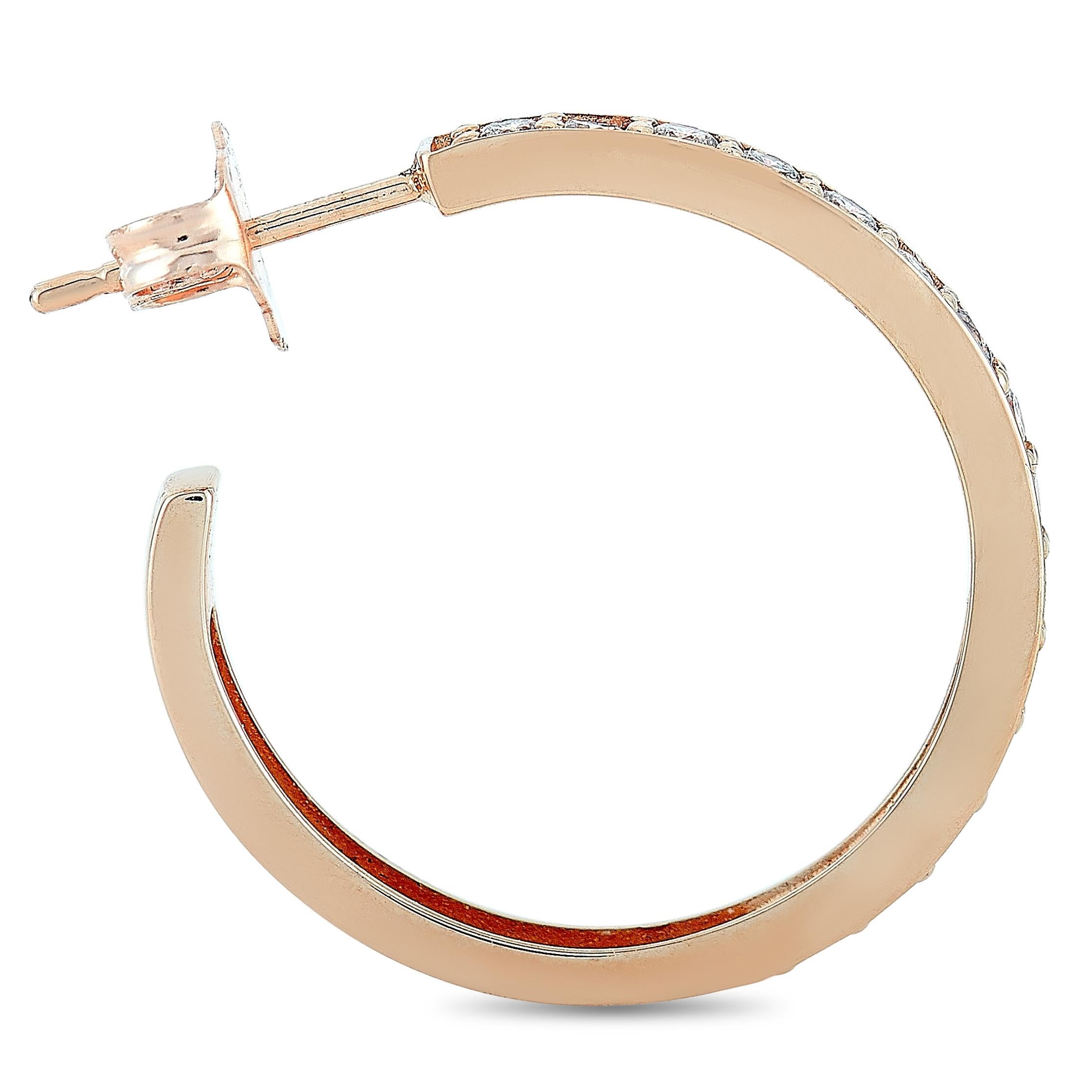 These LB Exclusive hoop earrings are made of 14K rose gold and each of the two weighs 1.65 grams. They measure 0.75” in height and boast a 0.75” hoop diameter. The pair is embellished with diamonds that amount to 0.75 carats.
 
 The earrings are