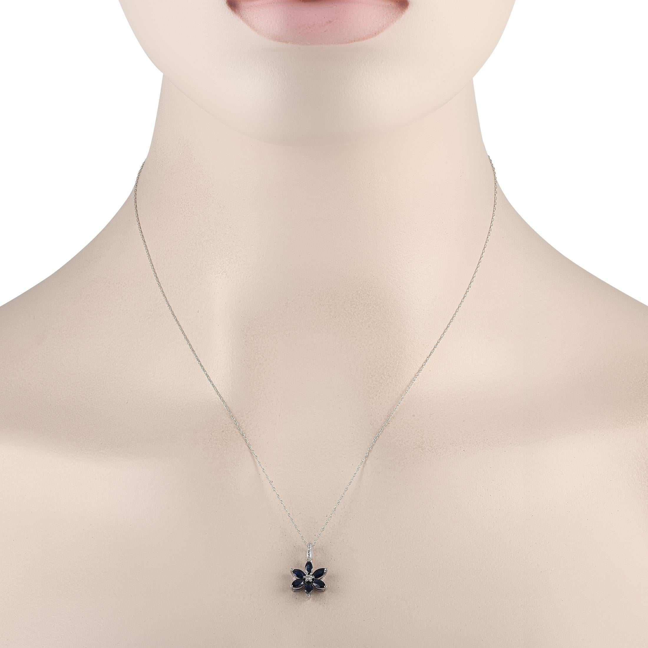 This diamond and sapphire floral necklace is what will soon be your favorite trinket. It is beautifully crafted in 14K white gold, with a double cable chain measuring 18 inches long. The flower-shaped pendant measures less than an inch in diameter
