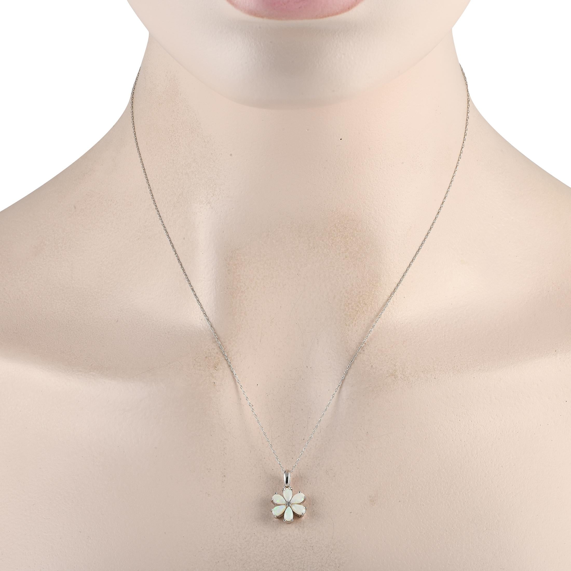 A floral shaped pendant makes a statement on this simple, elegant necklace. Crafted from 14K White Gold, the pendant comes to life thanks to radiant Opal petals and a single 0.01 carat Diamond stone at the center. It measures 0.75 long by 0.50 wide