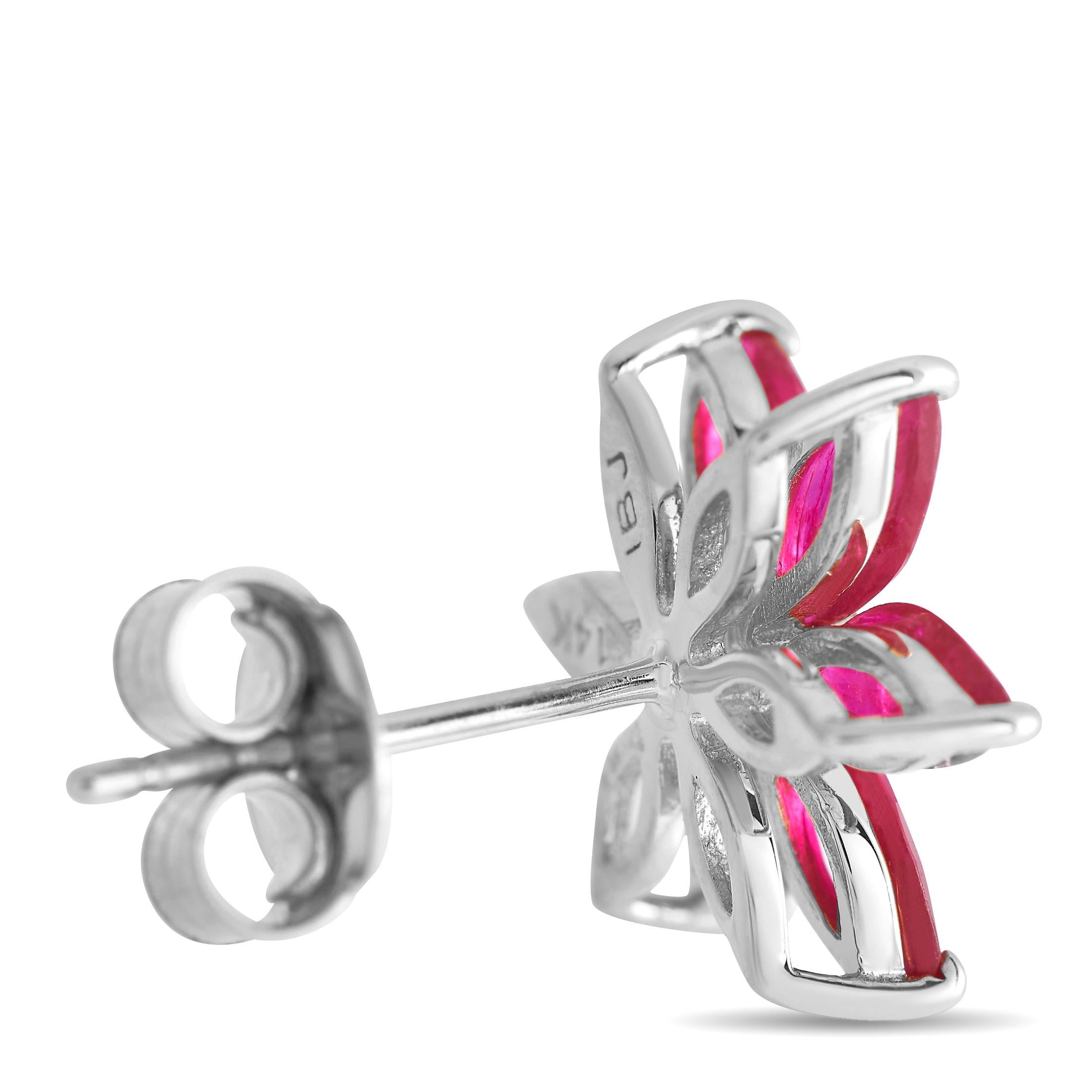 Polish your ladylike looks with these floral earrings decorated with marquise-cut rubies. Each 14K white gold stud has a floral basket mounted with marquise ruby petals and a diamond center. A push-back closure fastens the earring in place.Offered