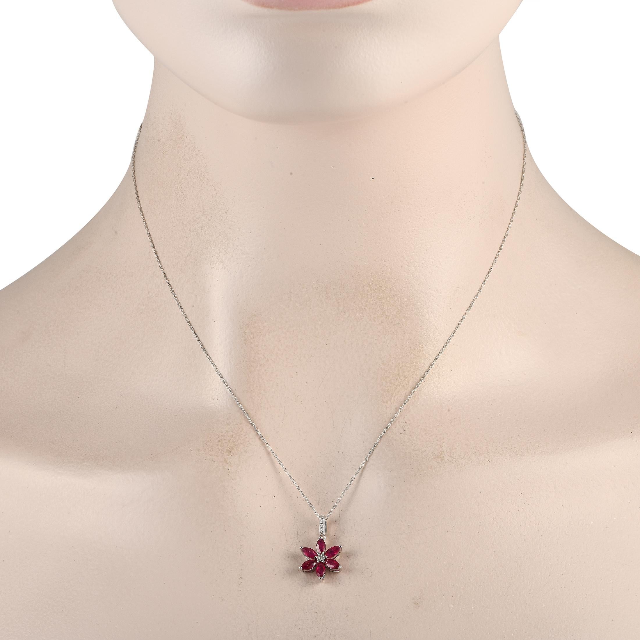 This luxury necklace is equal parts charming and sophisticated. Suspended from an 18 chain, a 14K White Gold floral pendant measures 0.75 long by 0.50 wide. Its elevated by radiant Ruby petals and additional Diamond accents with a total weight of