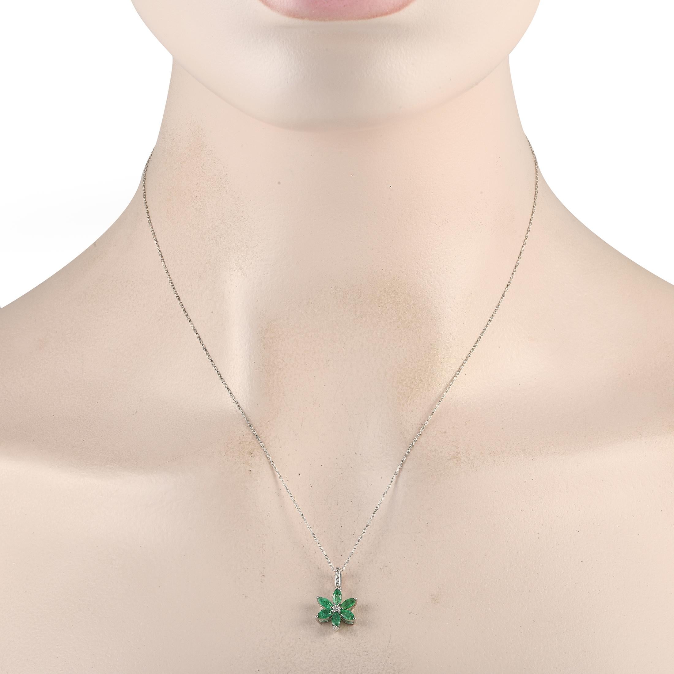 A charming 14K white gold floral pendant takes center stage on this exquisite necklace. Emerald petals provide the perfect pop of color, while diamonds with a total weight of 0.01 carats serve as a stylish finishing touch. This pieces pendant