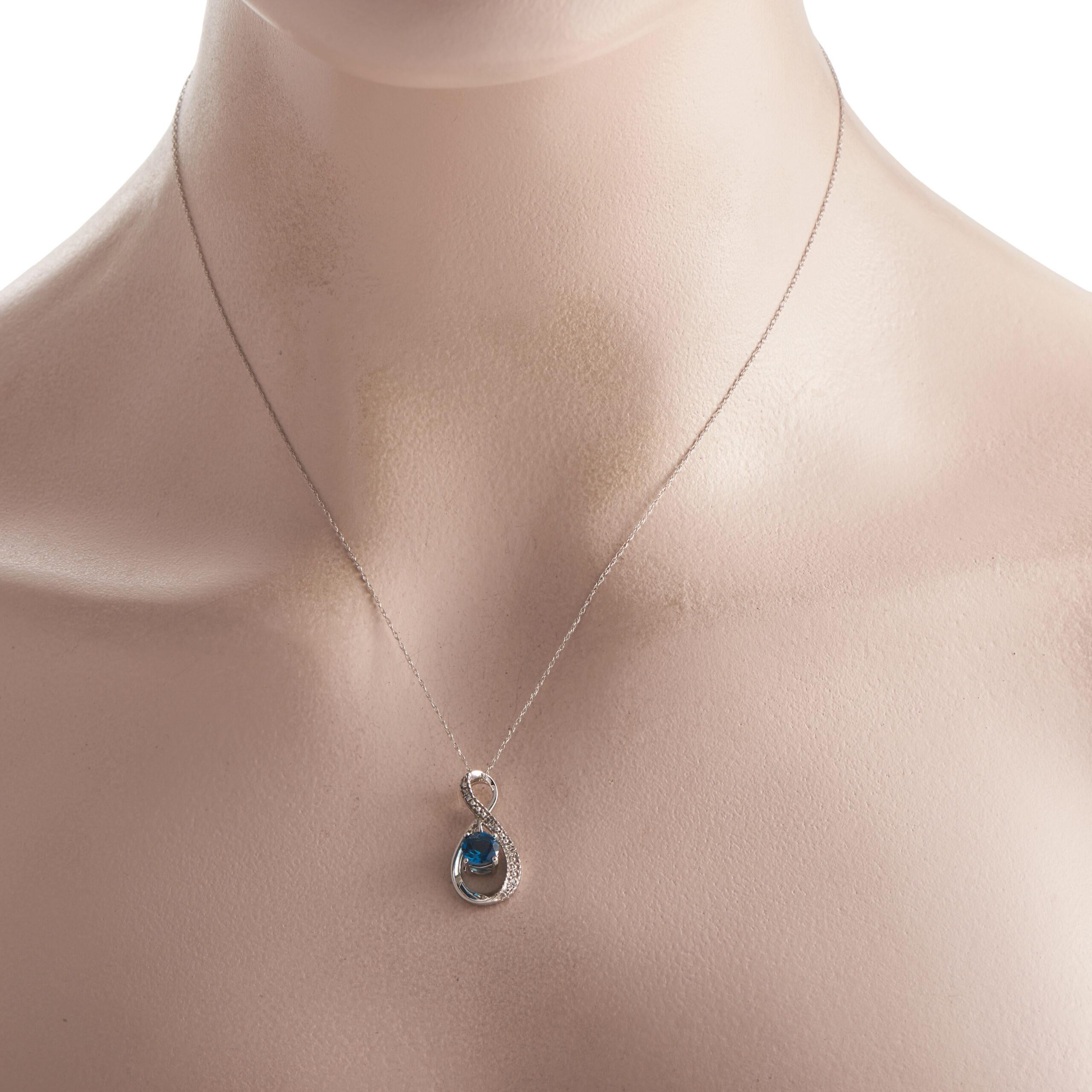 An alluring jewelry gift for a December-born or a December anniversary. This LB Exclusive necklace in 14K white gold features a stylized infinity pendant decorated with a wavy row of round diamonds and a beautiful blue topaz gemstone. The double