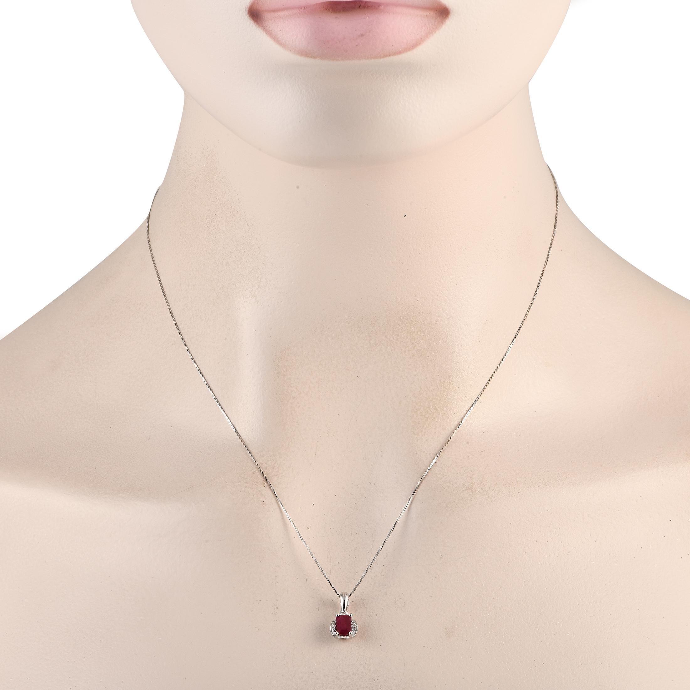 This luxurious necklace is inherently sophisticated. Suspended from a sleek 18 box chain, youll find a 14K White Gold pendant measuring 0.50 long by 0.25 wide. Diamonds with a total weight of 0.03 accent each side of the stunning Ruby center