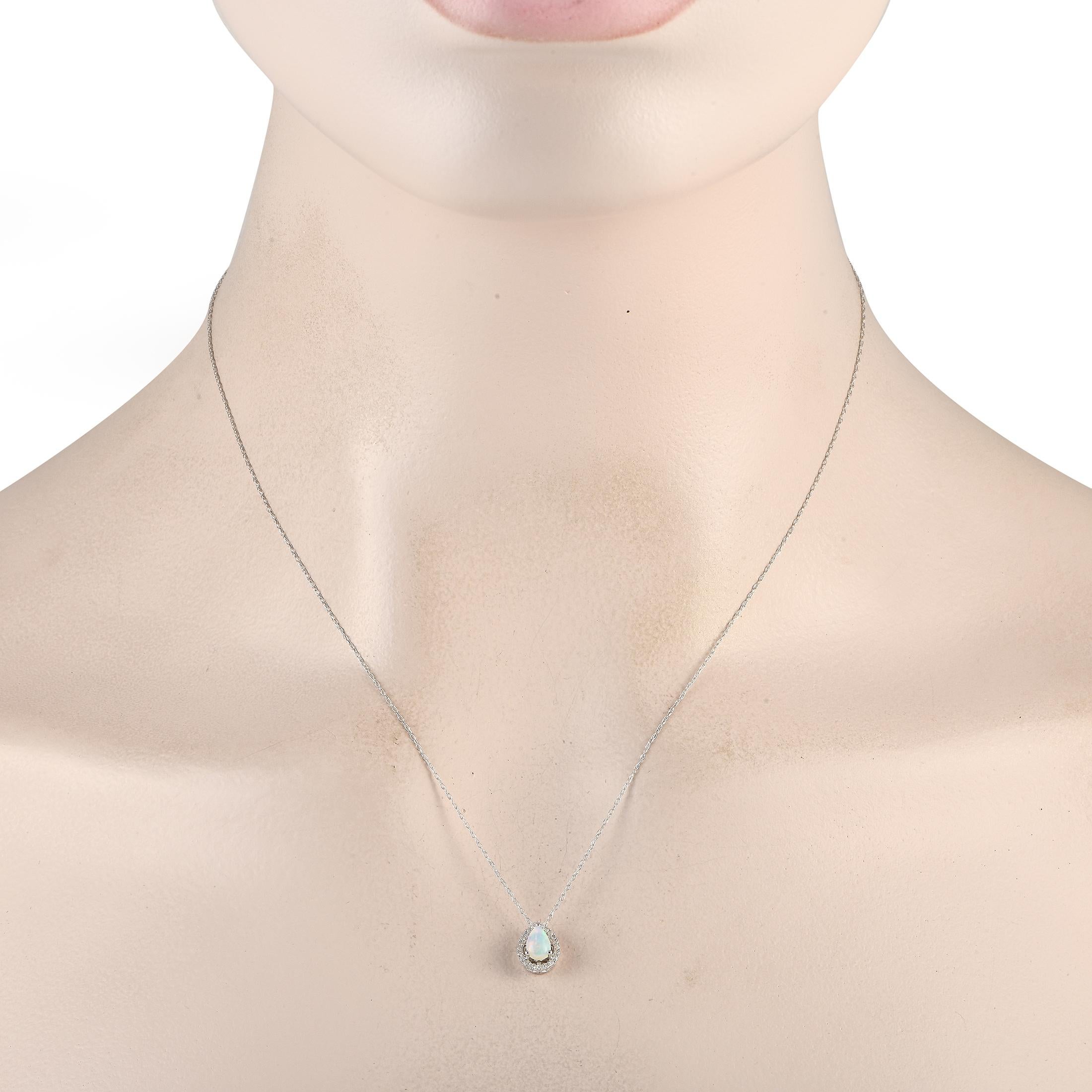 A radiant opal gemstone shines to life at the center of this necklaces stunning 14K white gold pendant. Suspended from an 18 chain, the pendant measures 1.25 long by 0.25 wide and comes to life thanks to 0.05 carats of sparkling diamond accents.This