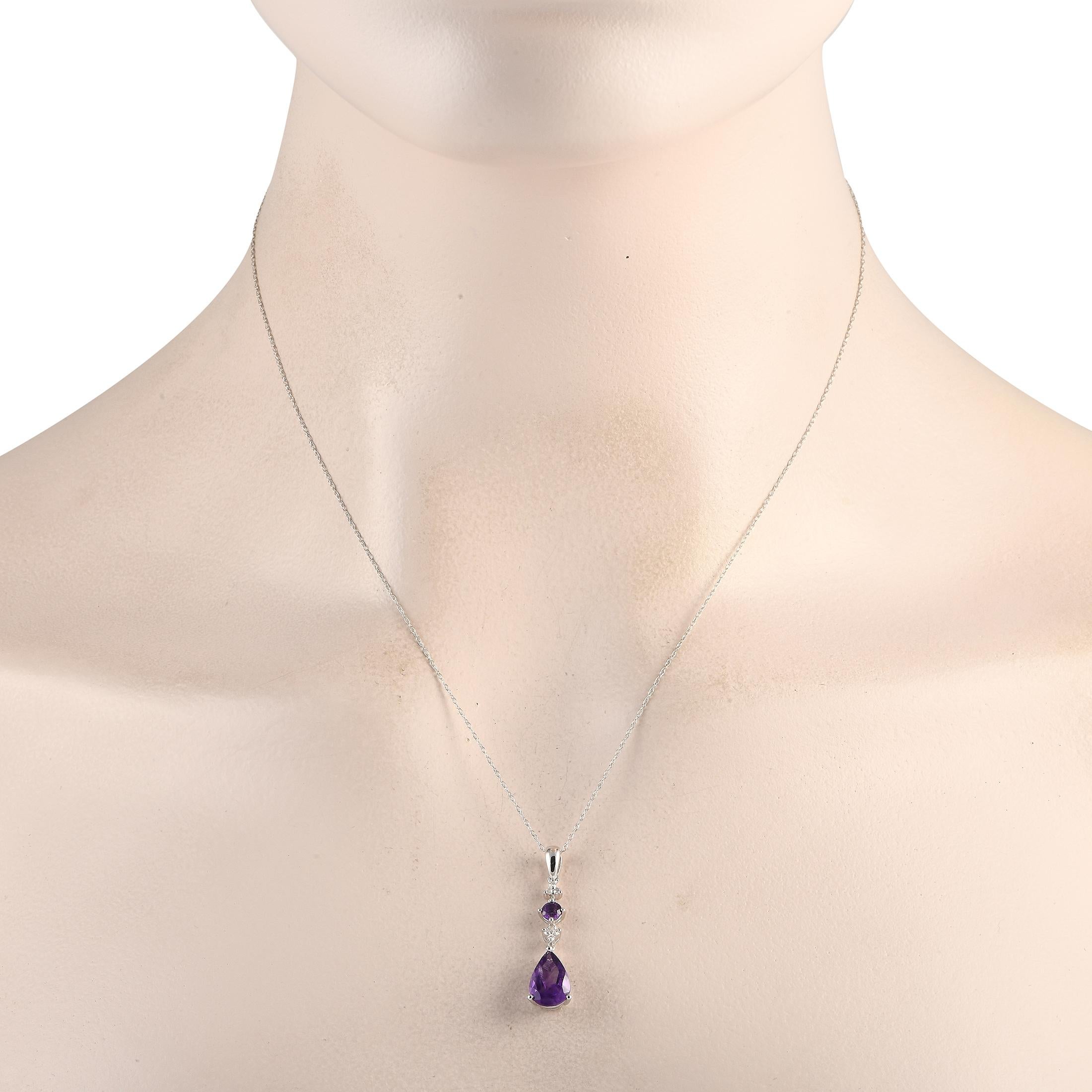 A pair of amethyst gemstones add color and visual impact to this timeless necklace. Sleek and elegant in design, it features a 14K white gold pendant measuring 1.25 long by 0.25 wide suspended from an 18 chain. Diamonds with a total weight of 0.05