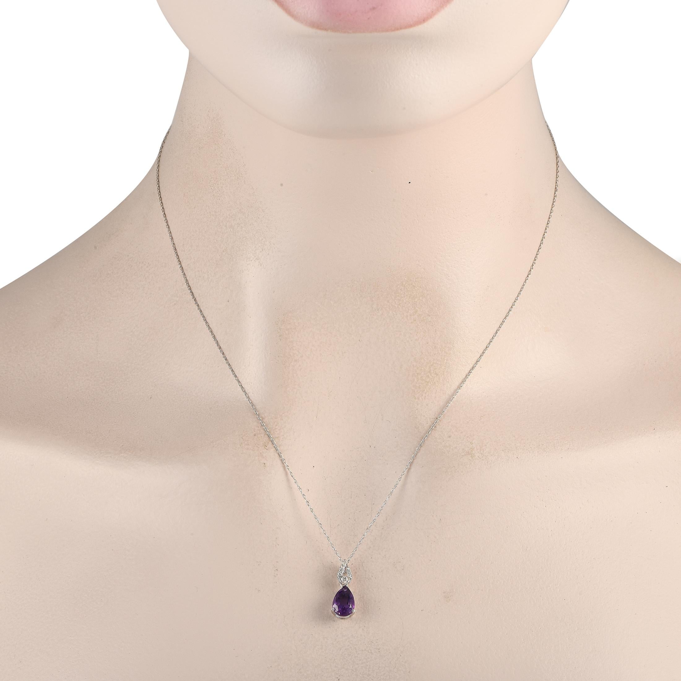 There's something about the barely there beauty of this piece. The thin necklace chain is fashioned from 14K white gold, holding a diamond-studded swirled link as its bail. Dropping from the glittering connector is a faceted pear-shaped amethyst on