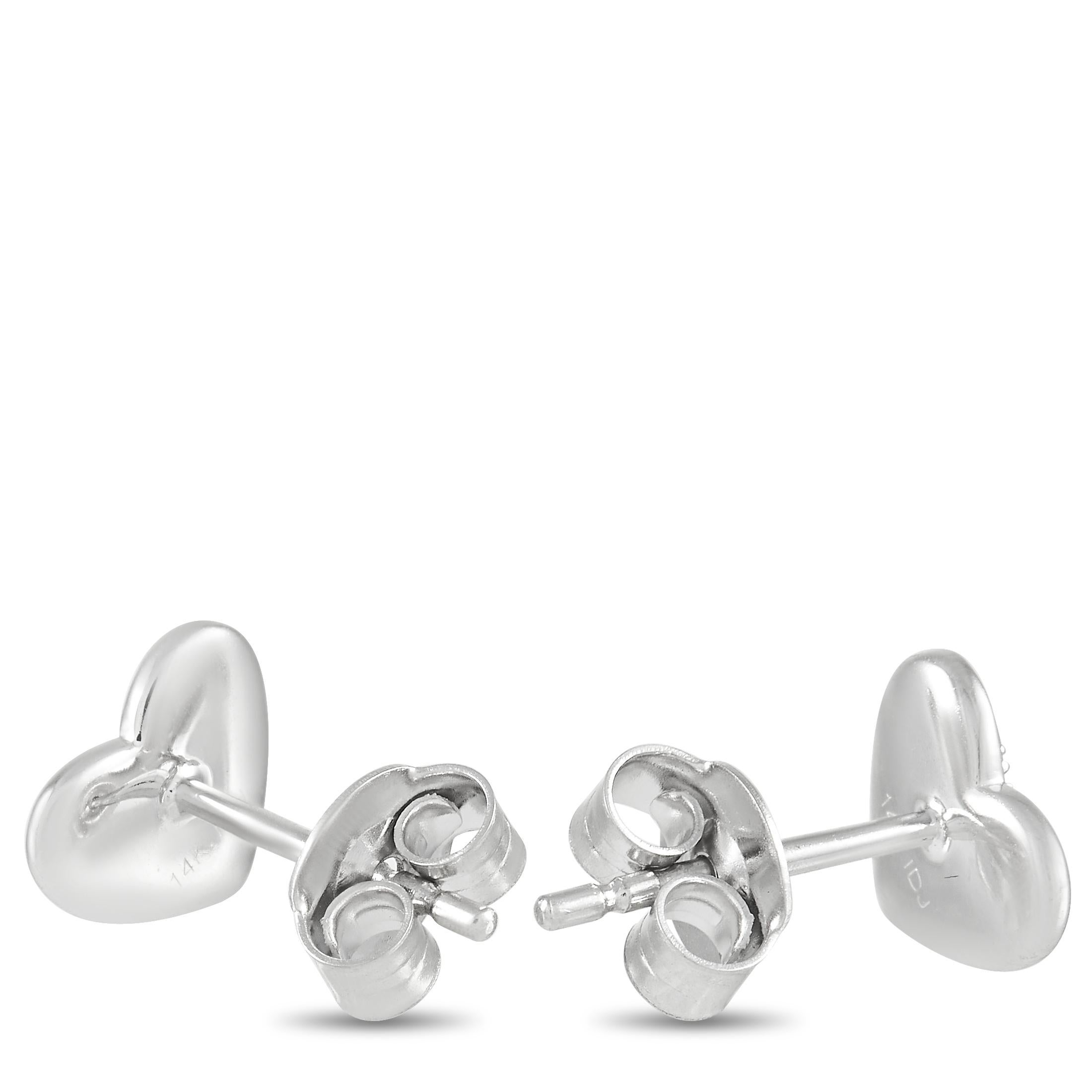 Sweet and stylish, these heart-shaped diamond earrings are incredibly charming. Each one is crafted from 14K White Gold and measures 0.45” round. Diamonds totaling 0.07 carats add a touch of sparkle to these elegant earrings. 
 
 This jewelry piece