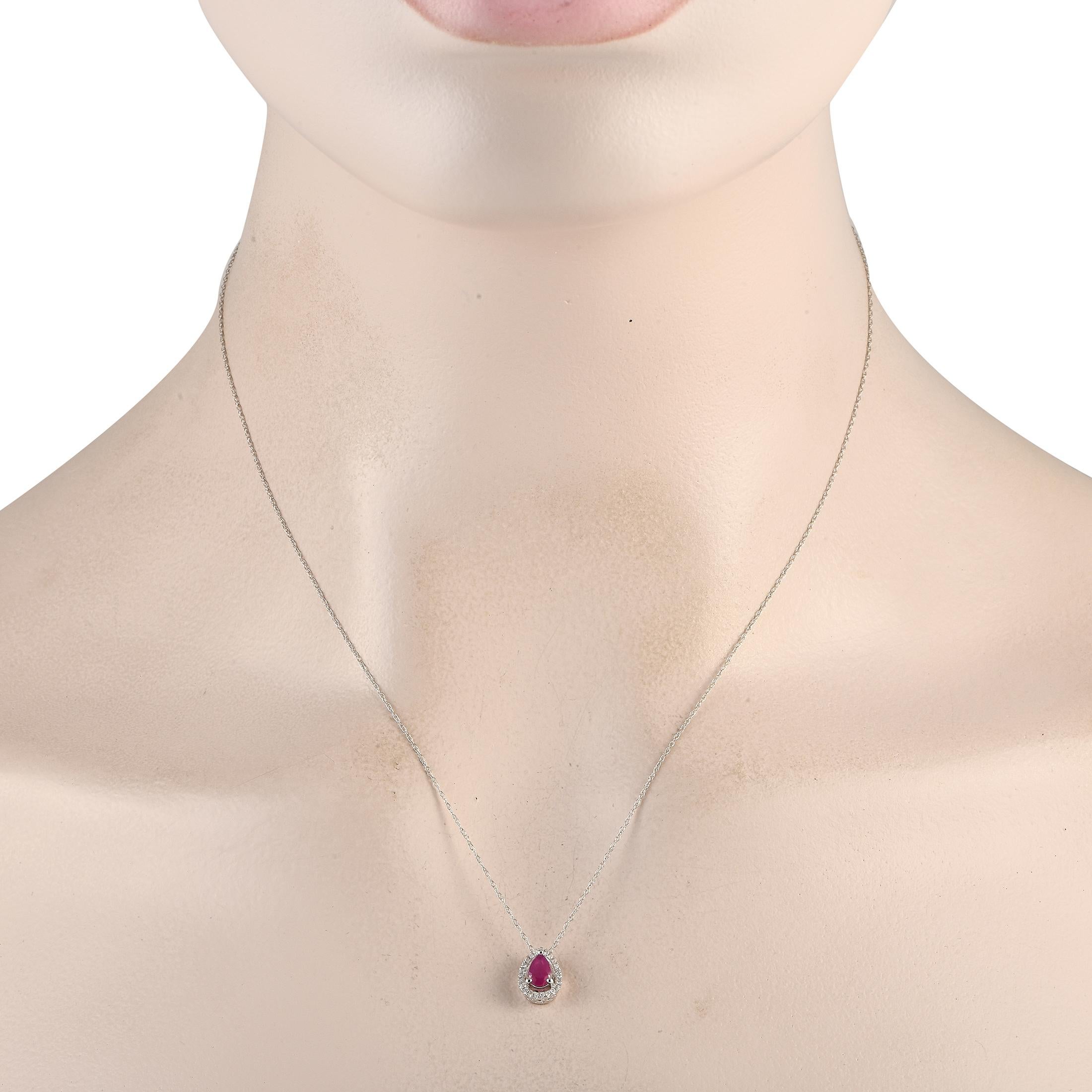 This necklace is inherently sophisticated. Suspended from an 18 chain, youll find a dainty 14K white gold pendant measuring 0.45 long by 0.25 wide. It comes complete with a captivating ruby center stone surrounded by diamonds totaling 0.07