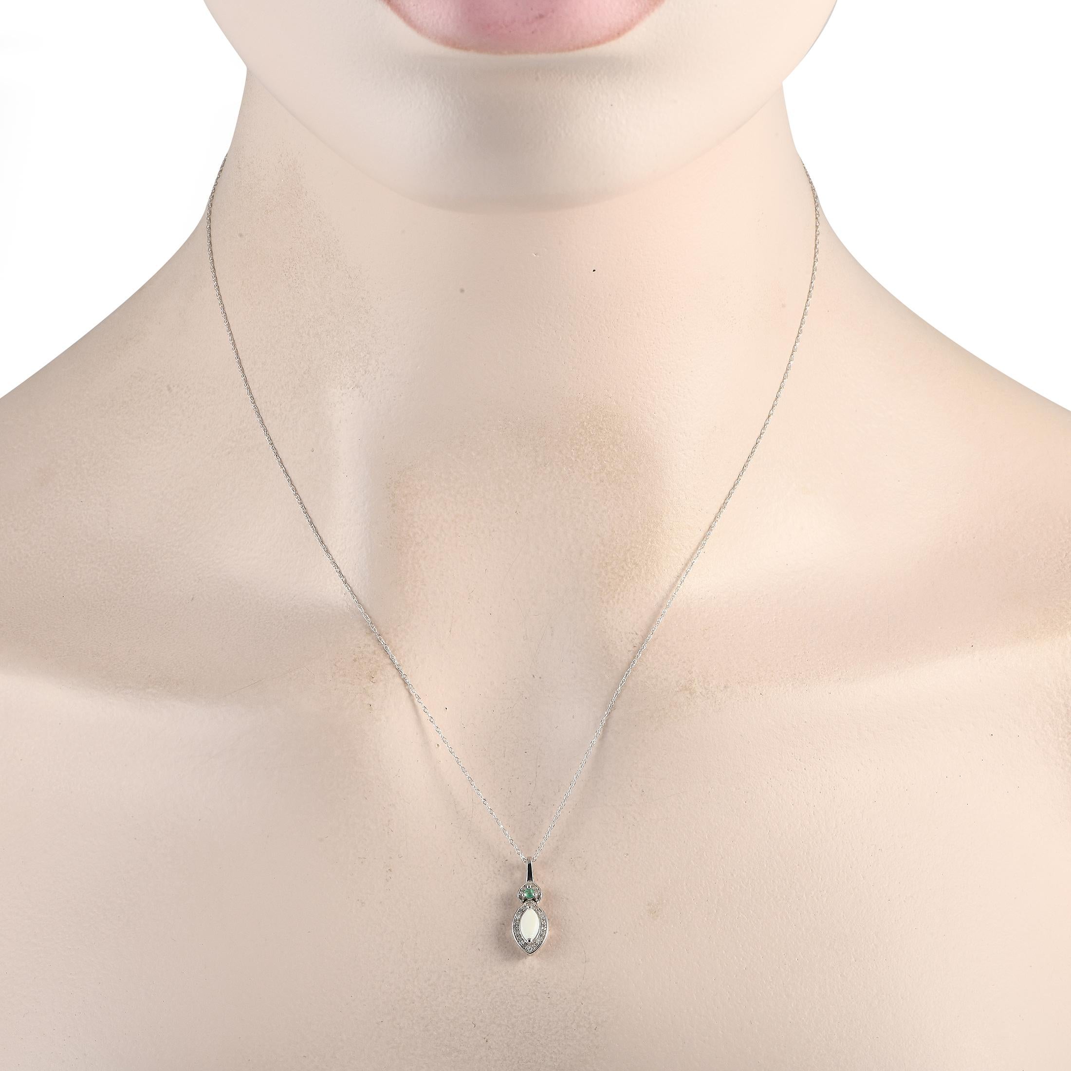 Theres something charming about this elegant necklace. Simple and understated in design, this pieces radiant 14K White Gold pendant comes to life thanks to a brilliant Opal center stone, an Emerald gemstone, and Diamonds with a total weight of 0.07