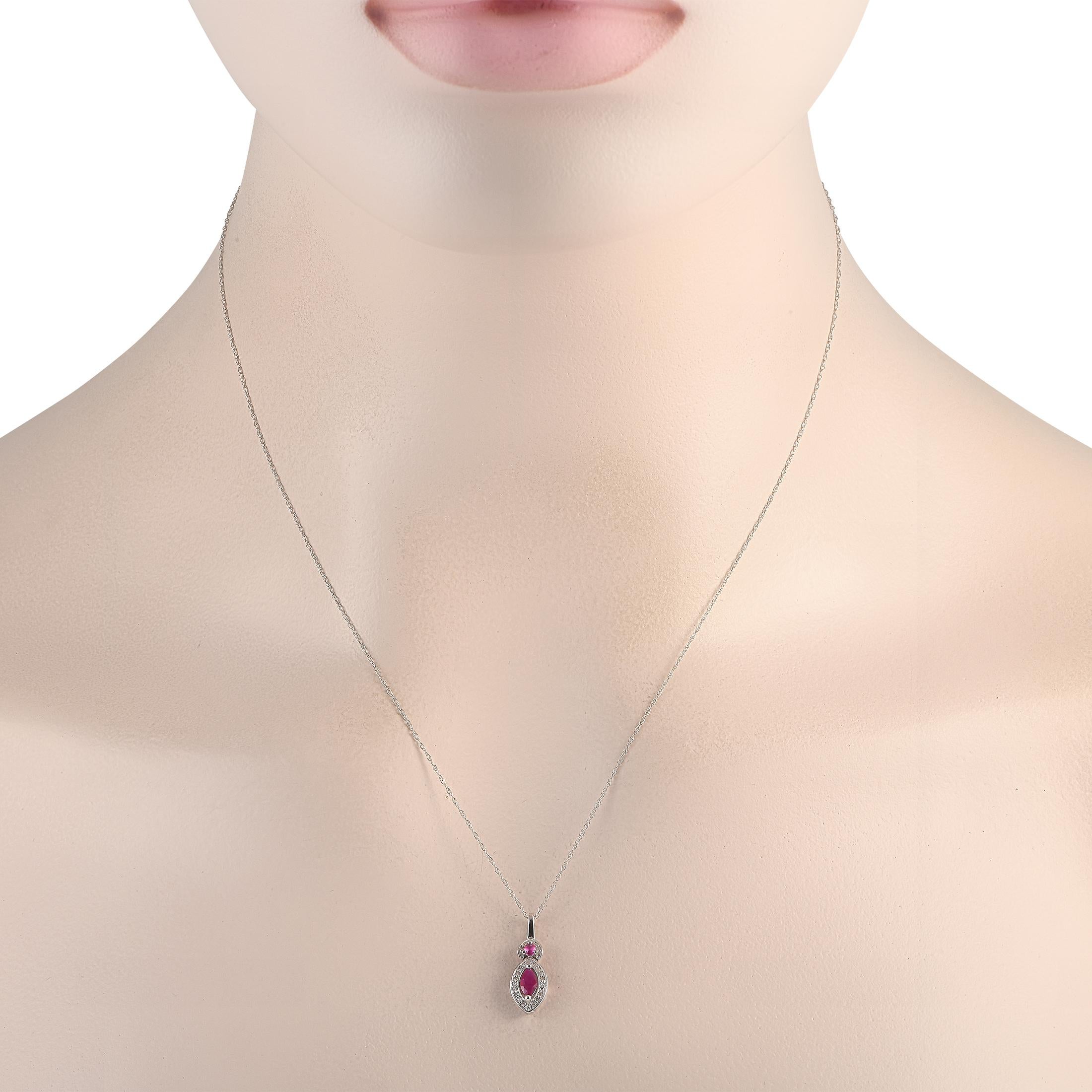 An eye-catching diamond and ruby necklace perfect as a gift for a July-born. This LB Exclusive piece is crafted in 14K white gold. It has a polished bail holding a petite circular frame with diamonds on the edges and a round ruby at the center.