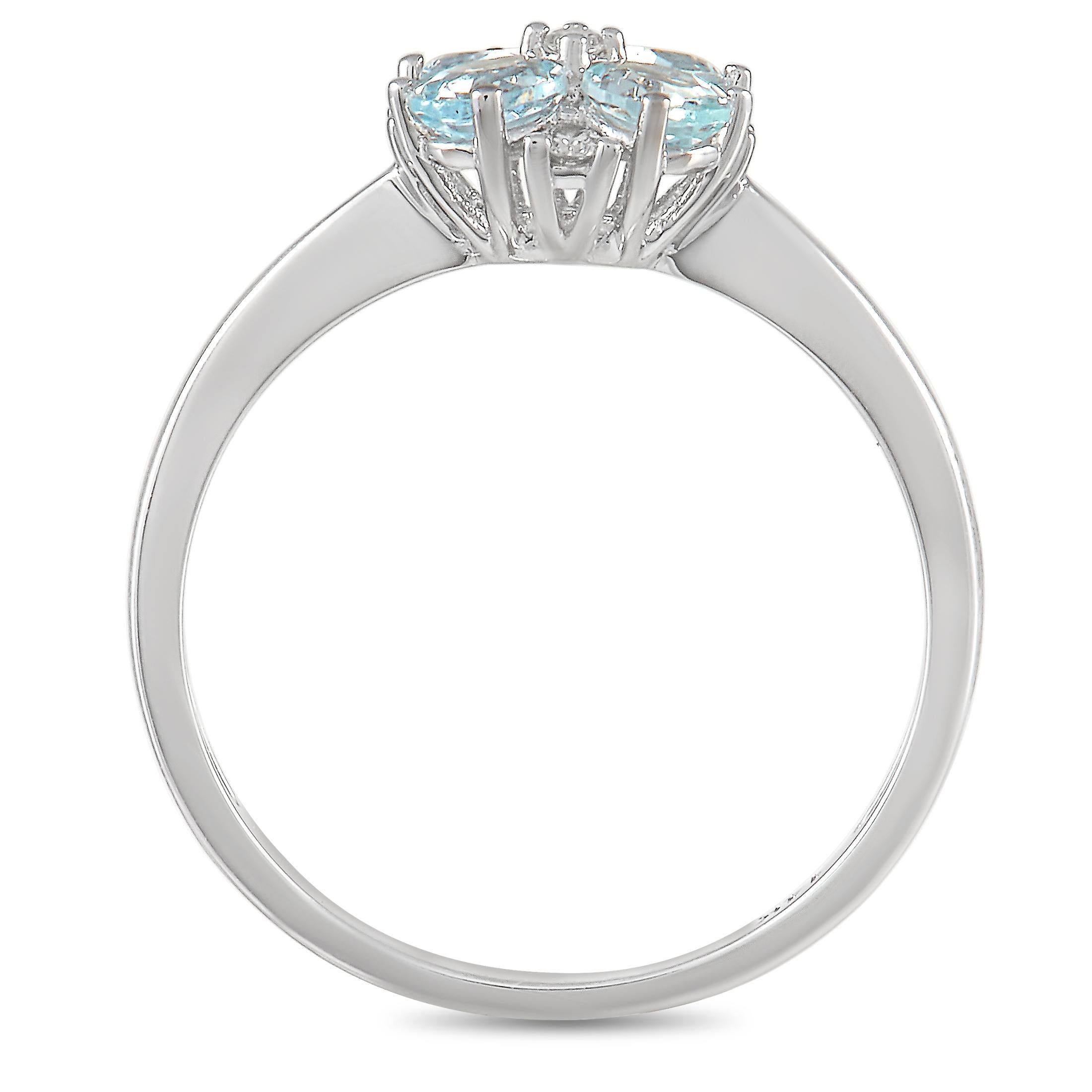 At the center of this exquisite ring, four light blue Aquamarine gemstones serve as a fabulous focal point. Diamond accents with a total weight of 0.08 carats add even more elegance to this minimalist design. The 14K White Gold setting features a