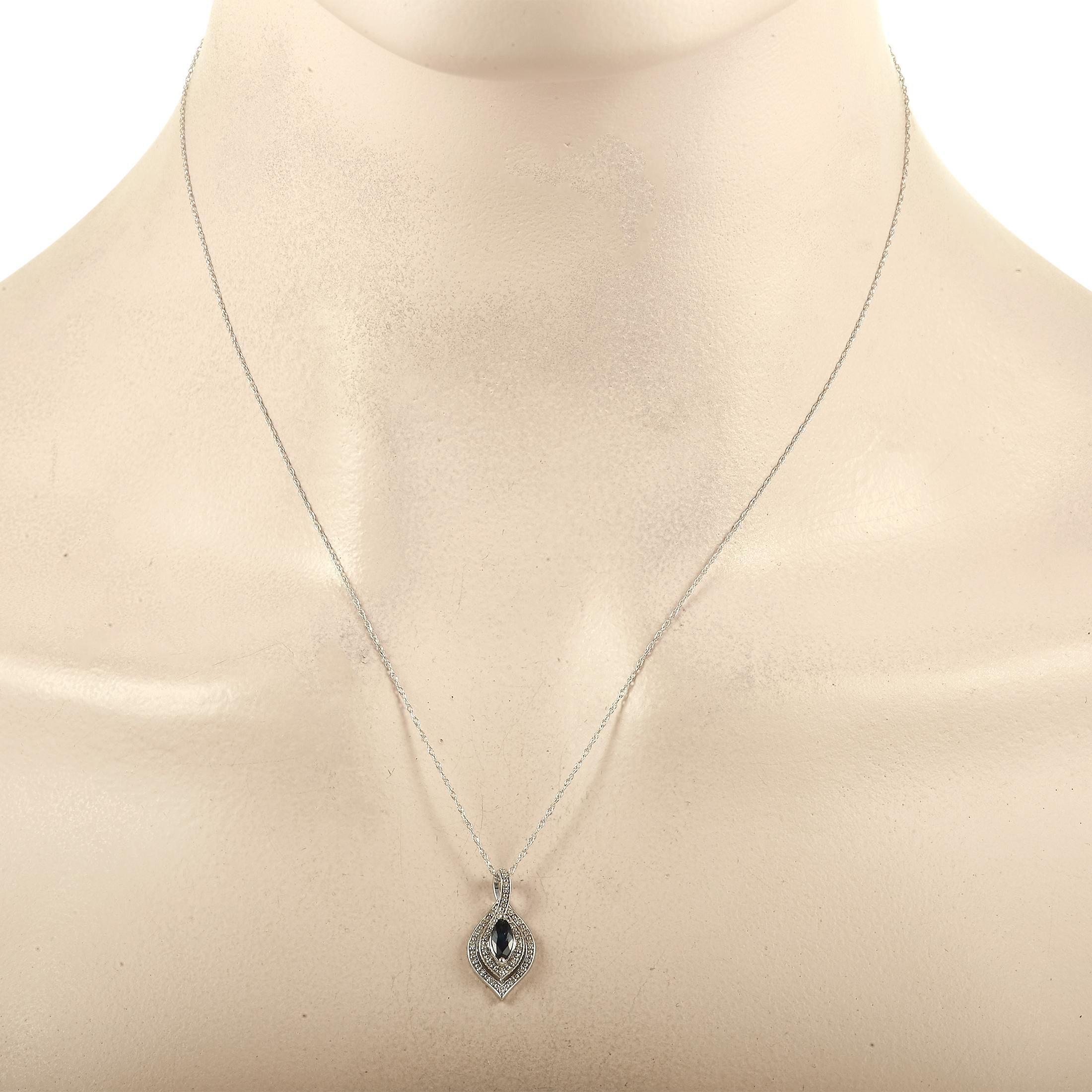 A classically elegant pendant measuring 0.75” long and 0.45” wide is suspended from a dainty 17.5” chain on this exceptional necklace. Crafted from 14K White Gold, it comes complete with a bold sapphire center stone and diamond accents totaling 0.08