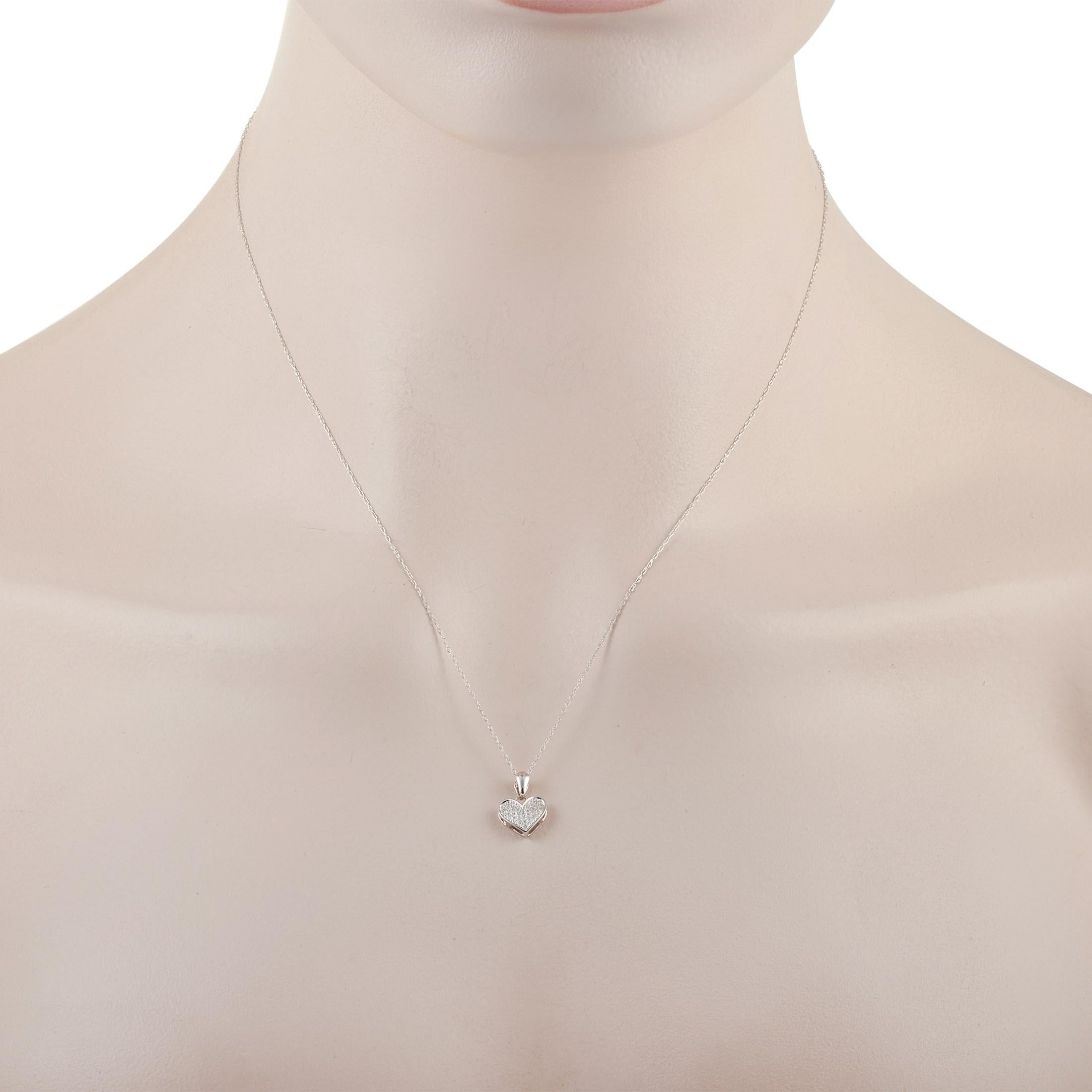 This LB Exclusive 14K White Gold 0.08 ct Diamond Heart Pendant Necklace features a delicate 14K White Gold chain that is 18 inches in length and includes a matching 14K White gold heart pendant set with 0.08 carats of round cut diamonds. The pendant