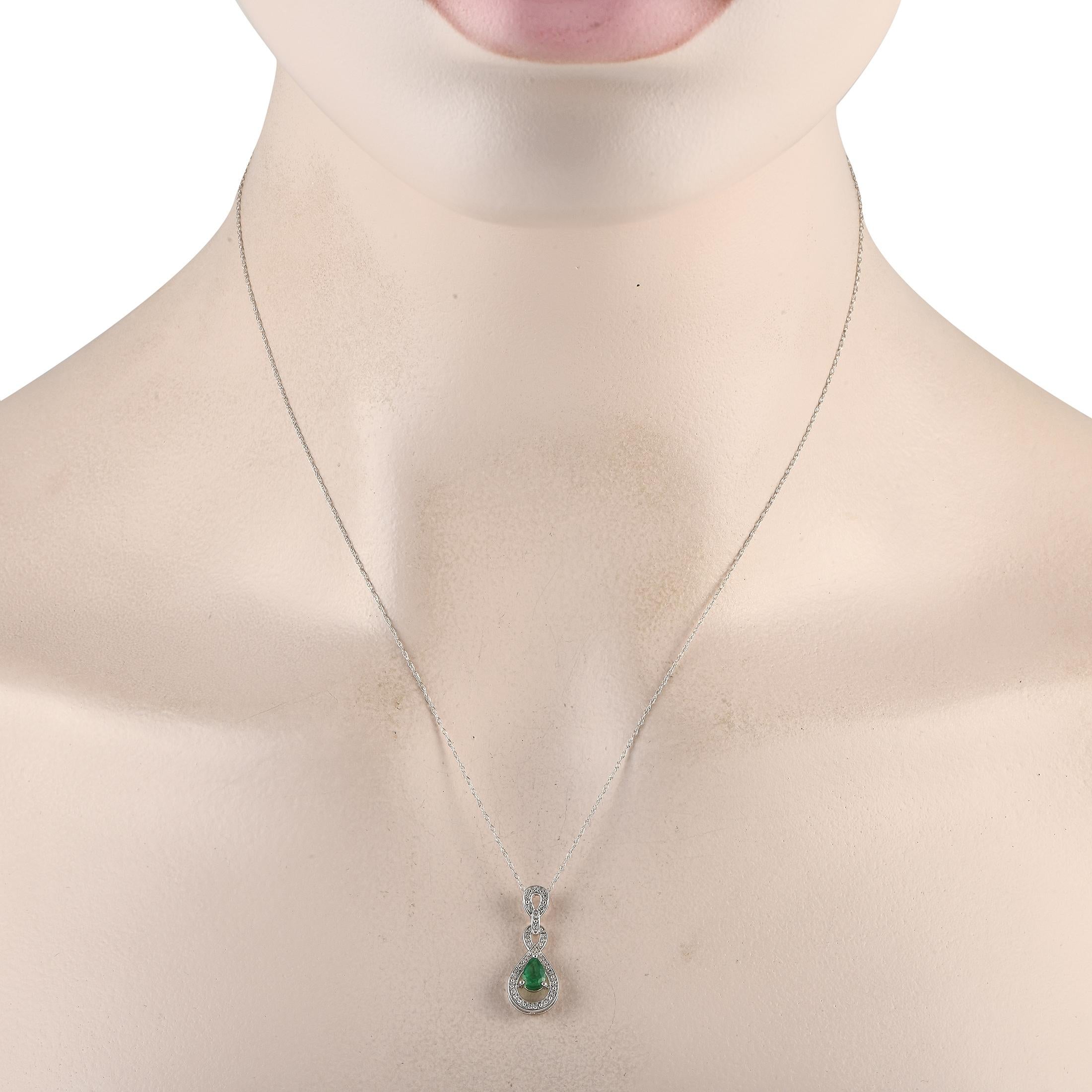 An intricate 14K White Gold pendant measuring 0.85 long by 0.45 wide makes this necklace simply unforgettable. Suspended from an 18 chain, it comes to life thanks to an elegant oval-cut Emerald gemstone and sparkling Diamond accents totaling 0.08