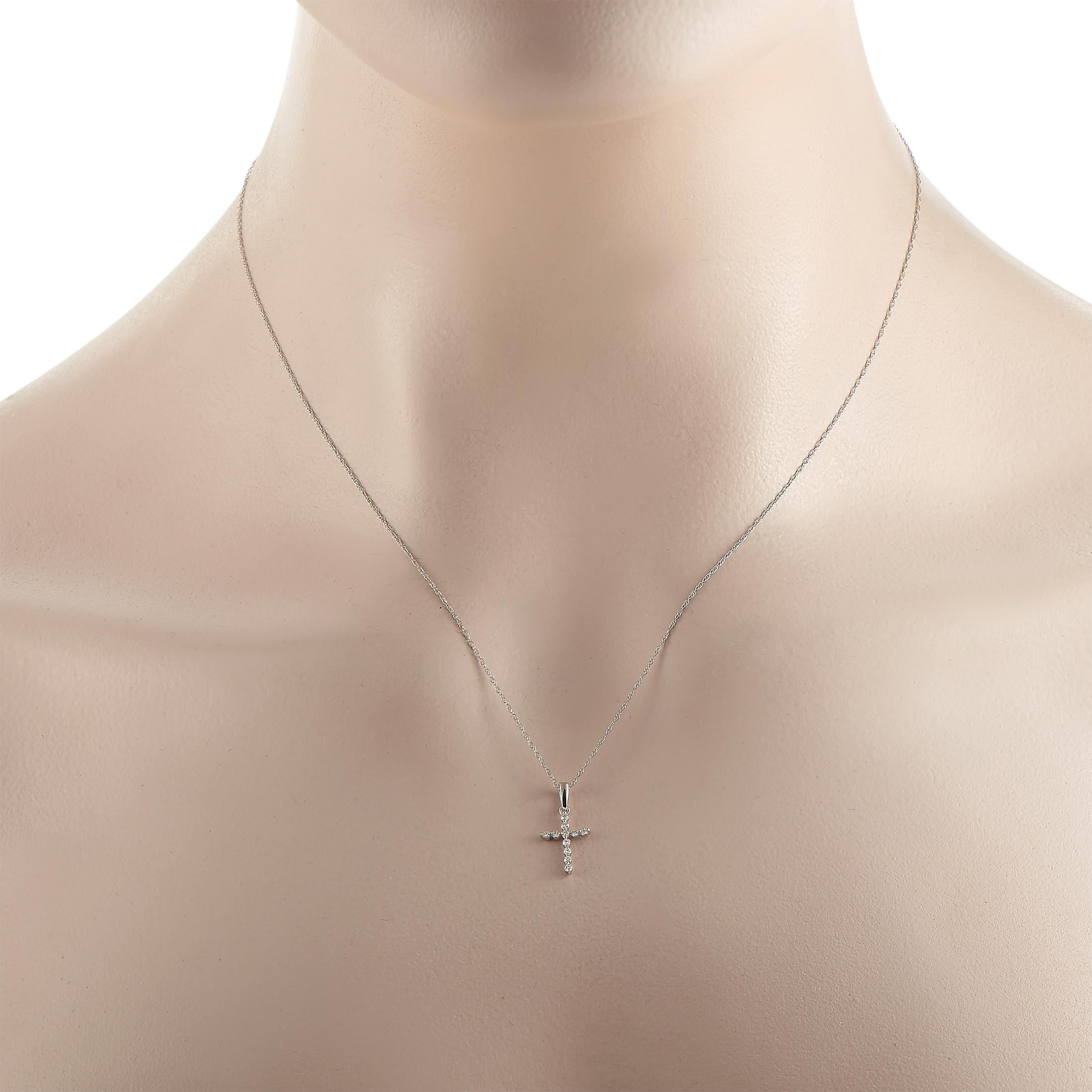 This stylish symbol of faith will continually sparkle and shine. On this impeccably designed necklace, a cross-shaped pendant measuring 0.75” long and 0.37” wide is suspended from an 18” chain. It’s crafted from 14K White Gold and comes complete