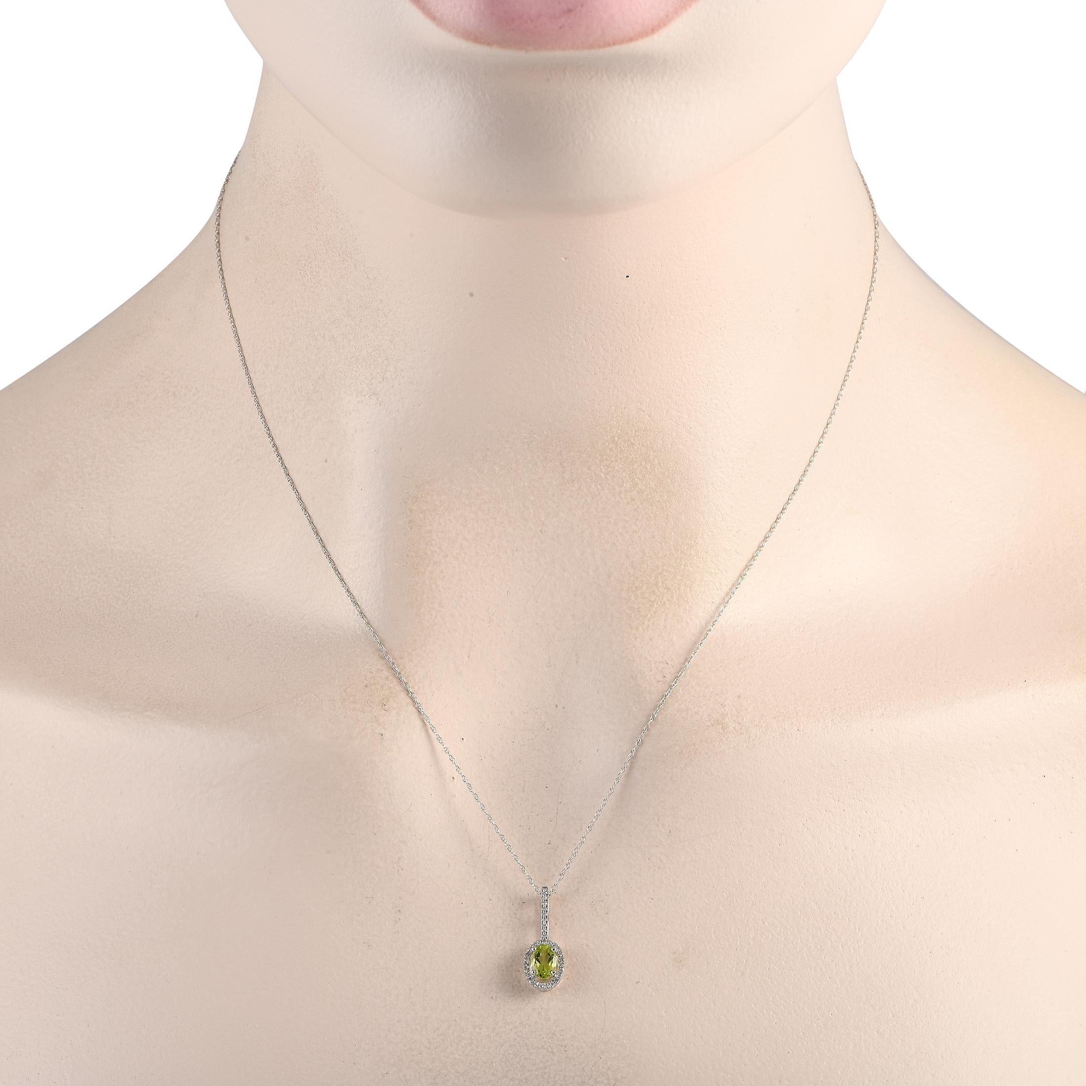 This simple, elegant necklace is ideal for anyone with a minimalist aesthetic. Suspended from an 18 chain, youll find a 14K White Gold pendant measuring 0.75 long by 0.25 wide. It comes complete with a sparkling green Peridot center stone and