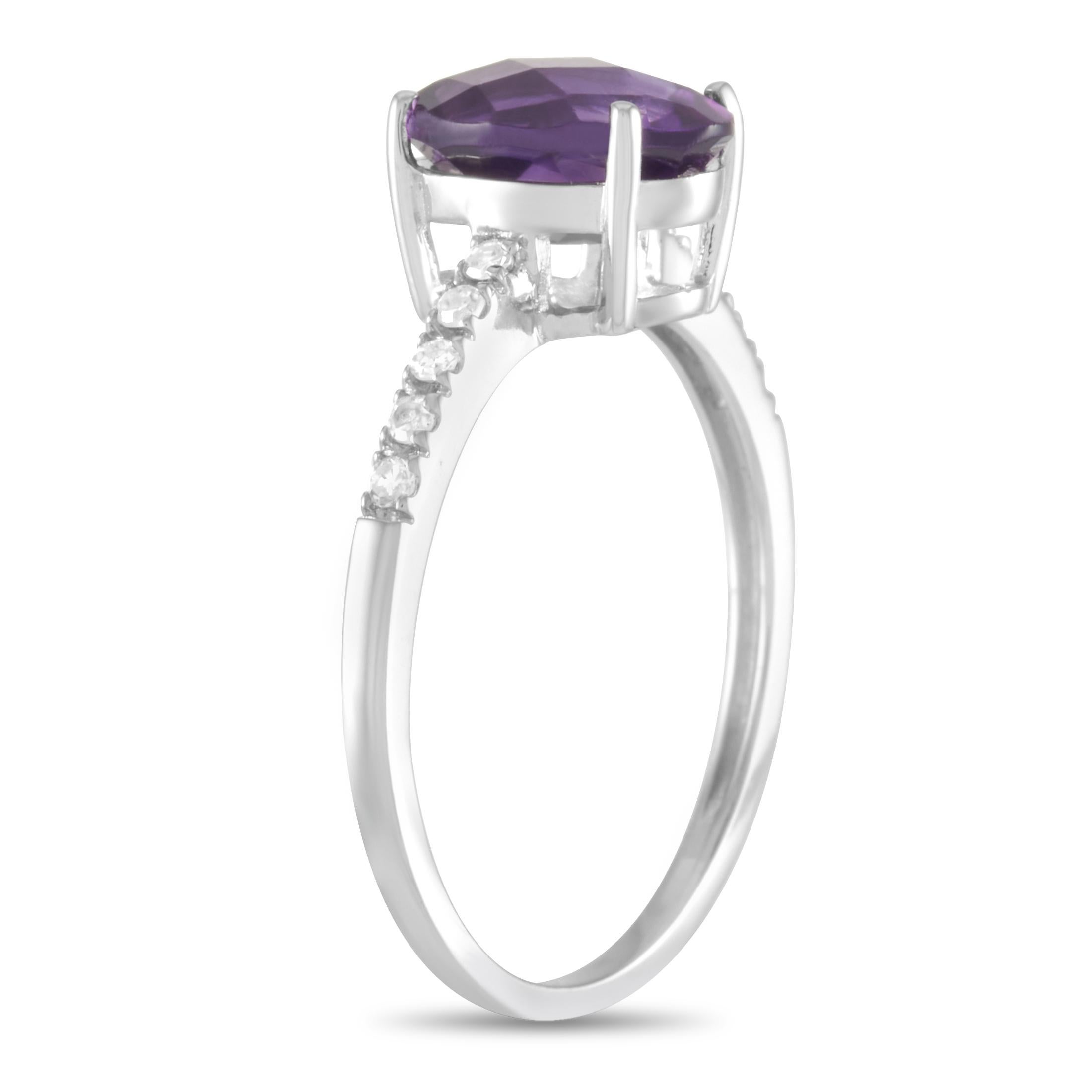 This LB Exclusive ring is made of 14K white gold and embellished with an oval amethyst and a total of 0.10 carats of diamonds. The ring weighs 2.4 grams and boasts band thickness of 2 mm and top height of 6 mm, while top dimensions measure 9 by 20