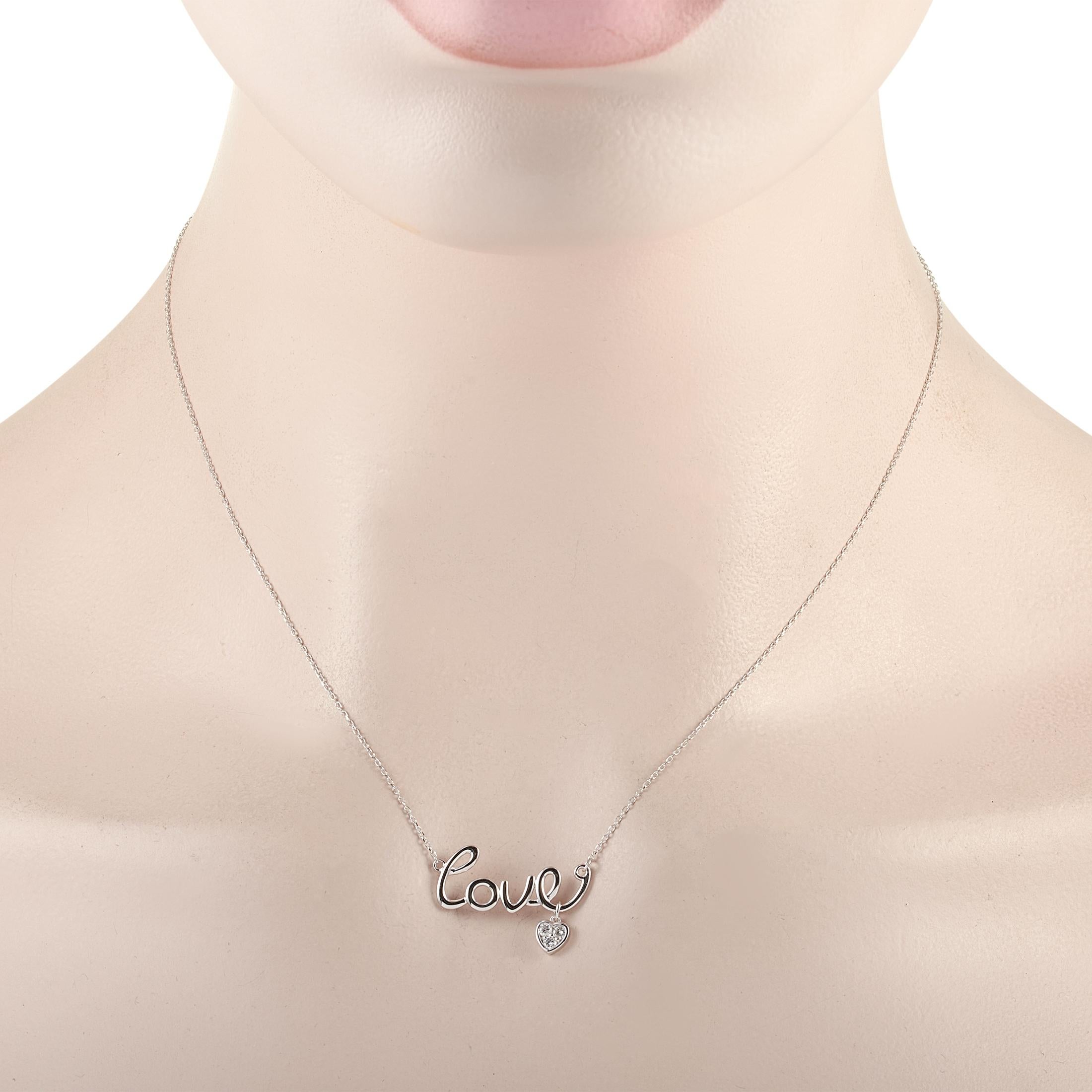 This LB Exclusive necklace is crafted from 14K white gold and weighs 2.4 grams. It is presented with a 15” chain and boasts a love pendant that measures 0.50” in length and 1” in width. The necklace is set with diamonds that total 0.10 carats.
 
