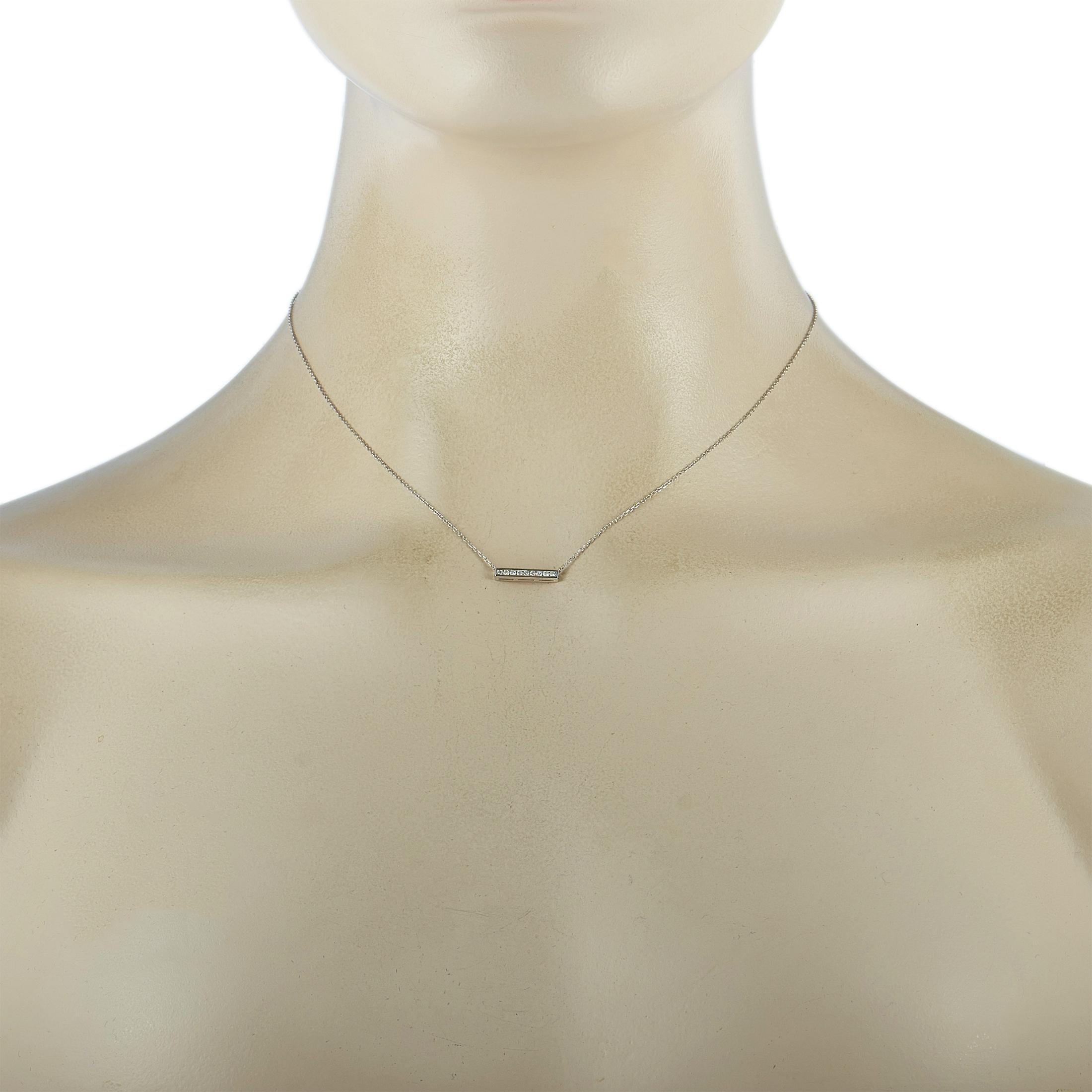 This LB Exclusive necklace is made of 14K white gold and embellished with diamonds that amount to 0.10 carats. The necklace weighs 1.5 grams and boasts a 15” chain and a pendant that measures 0.80” in length and 0.62” in width.
 
 Offered in brand