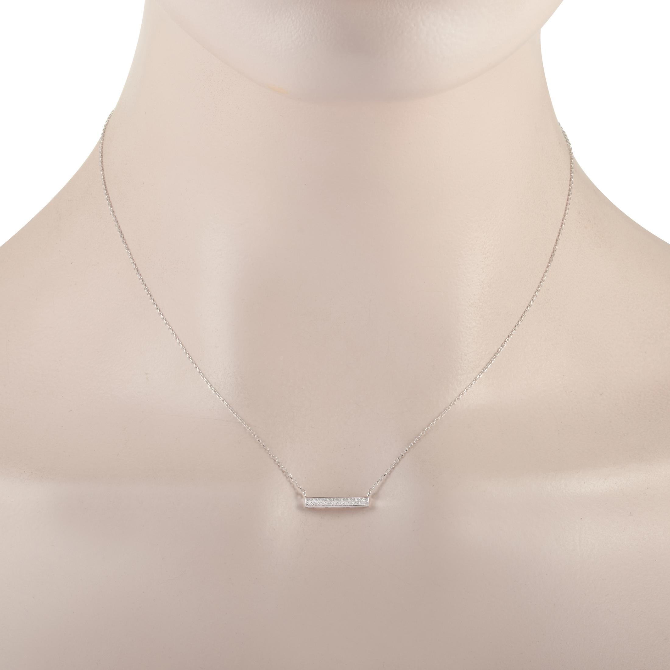 This LB Exclusive necklace is crafted from 14K white gold and weighs 1.5 grams. It is presented with a 15” chain and boasts a pendant that measures 0.13” in length and 0.63” in width. The necklace is set with diamonds that total 0.10 carats.
 

