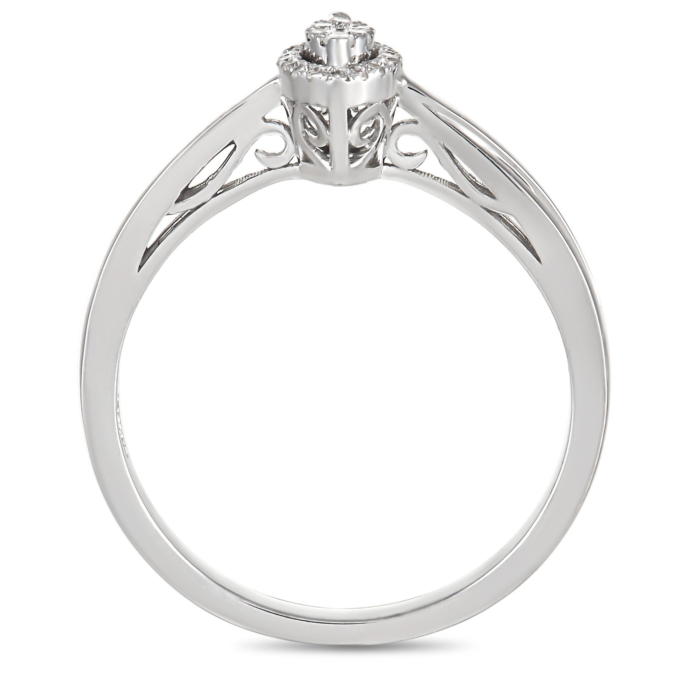 Cette élégante bague en or blanc 14 carats de 0,10 ct de diamants, exclusive à LB, ne manquera pas d'attirer les regards ! La bague est réalisée en or blanc 14 carats et sertie d'une grappe de diamants de taille ronde sur la face de l'anneau, pour